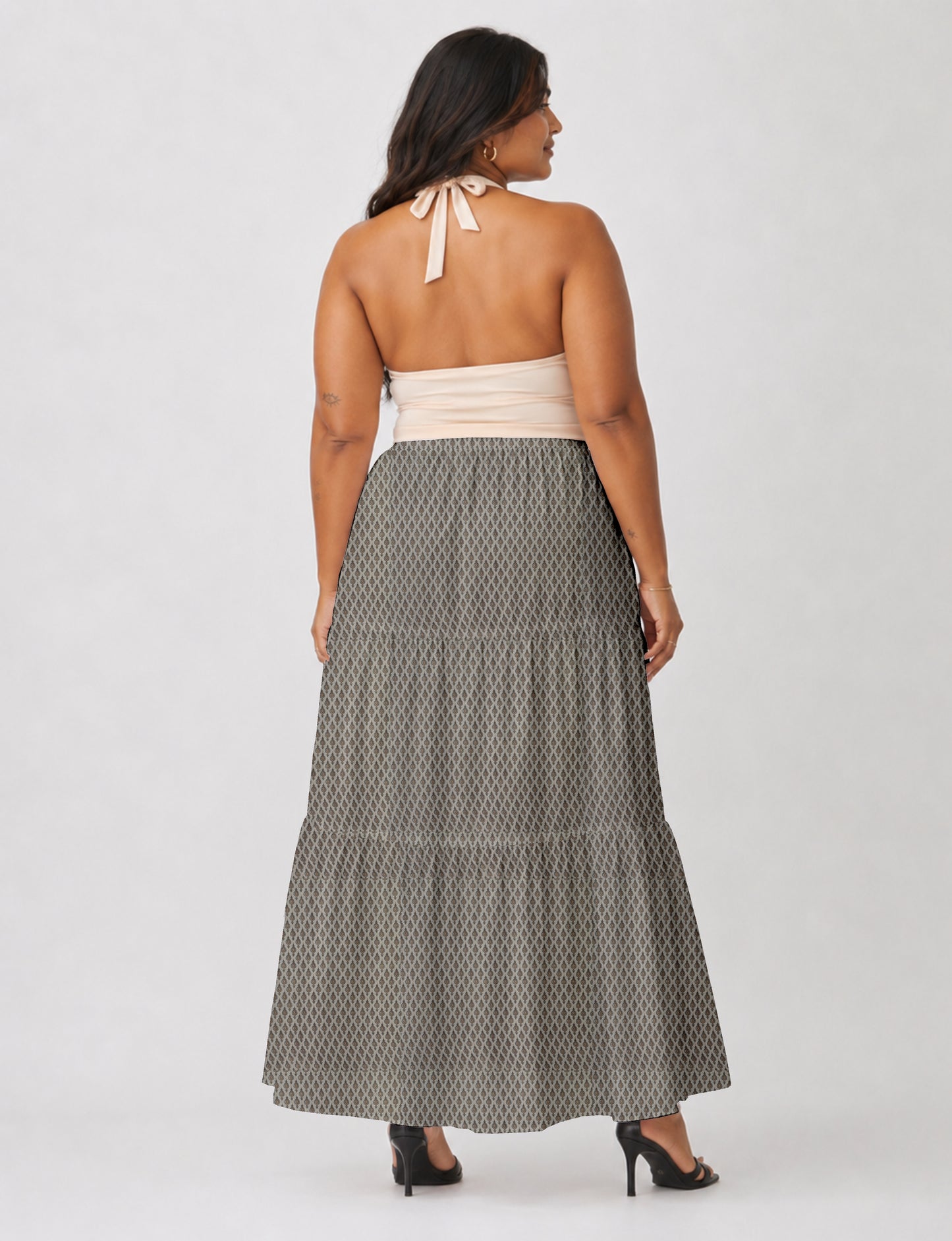 Yellow midi tiered skirt with small dark geometric micro pattern, flat lay front view