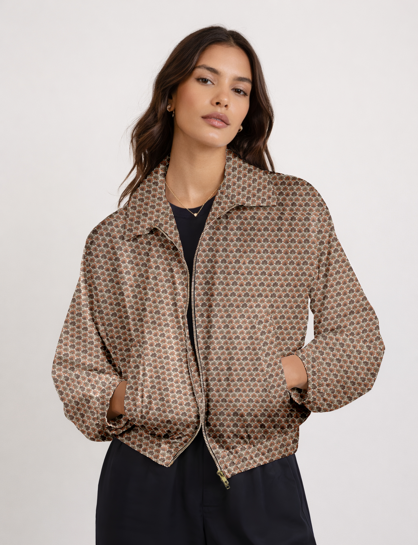 Beige bomber jacket with micro floral design, front zipper, collar, and pockets, worn by model in front view