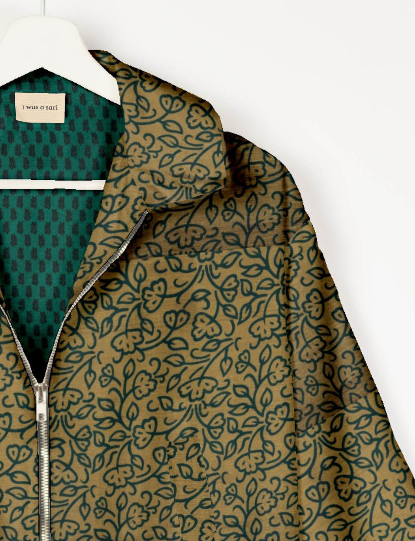 Upcycled Bomber Jacket made from recycled sari materials, featuring a cute cropped shape, elasticated hem and cuffs, and contrast sari print lining. Sustainable apparel promoting eco-friendly fashion and ethical clothing.