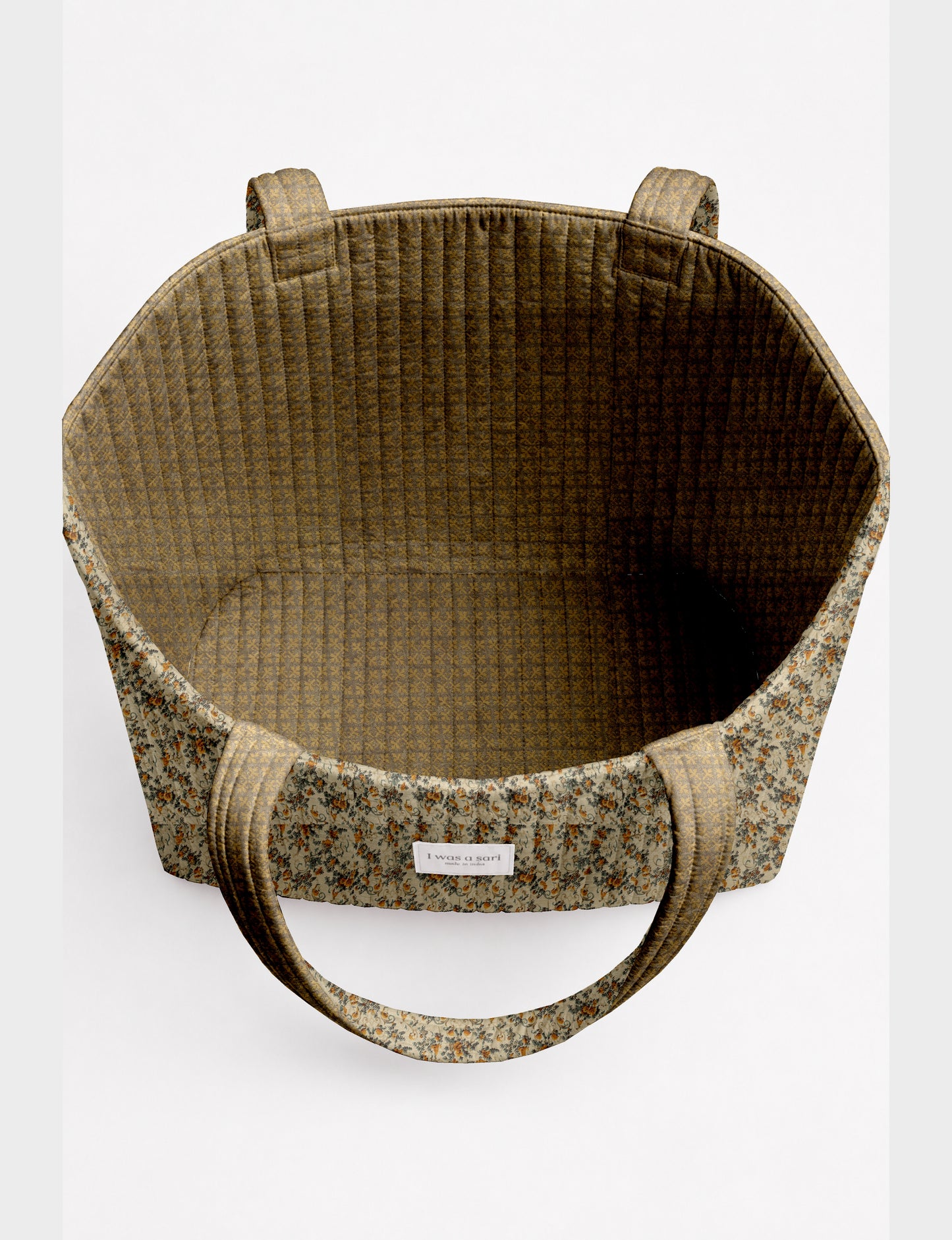 Large quilted beach bag with spacious rectangular design, reinforced shoulder straps, and open-top construction for everyday use and travel.