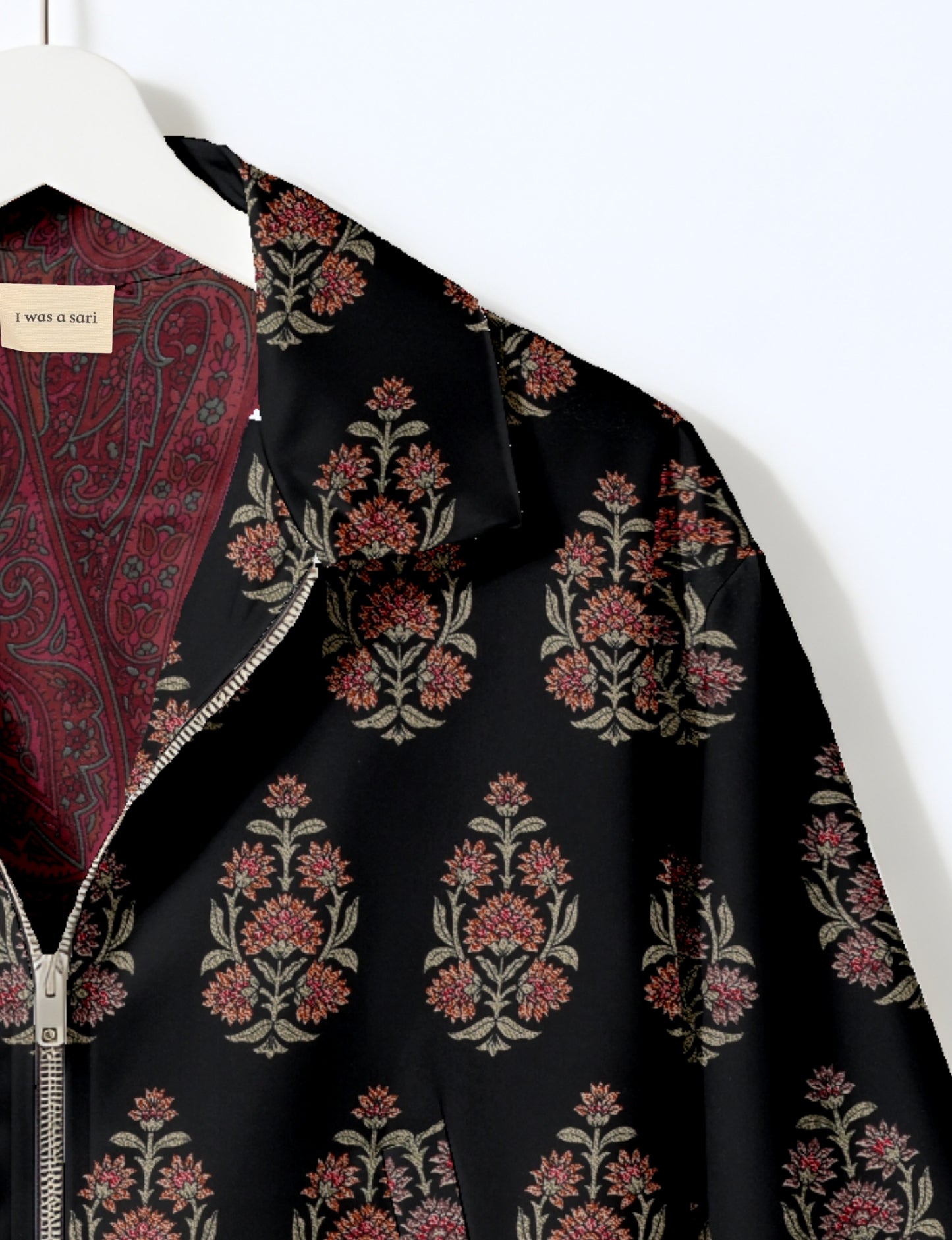Upcycled Bomber Jacket made from recycled sari materials, featuring a cute cropped shape, elasticated hem and cuffs, and contrast sari print lining. Sustainable apparel promoting eco-friendly fashion and ethical clothing.