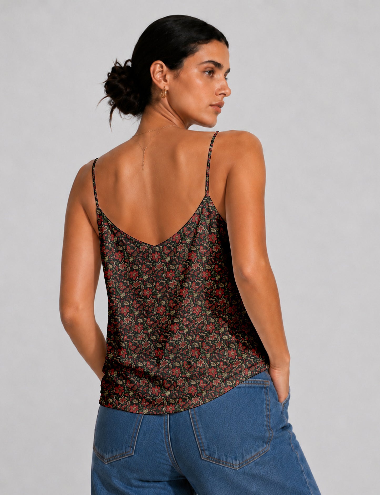 Women's sleeveless slip top with a relaxed straight fit, soft V-neckline, deep V-back, and delicate spaghetti straps.
