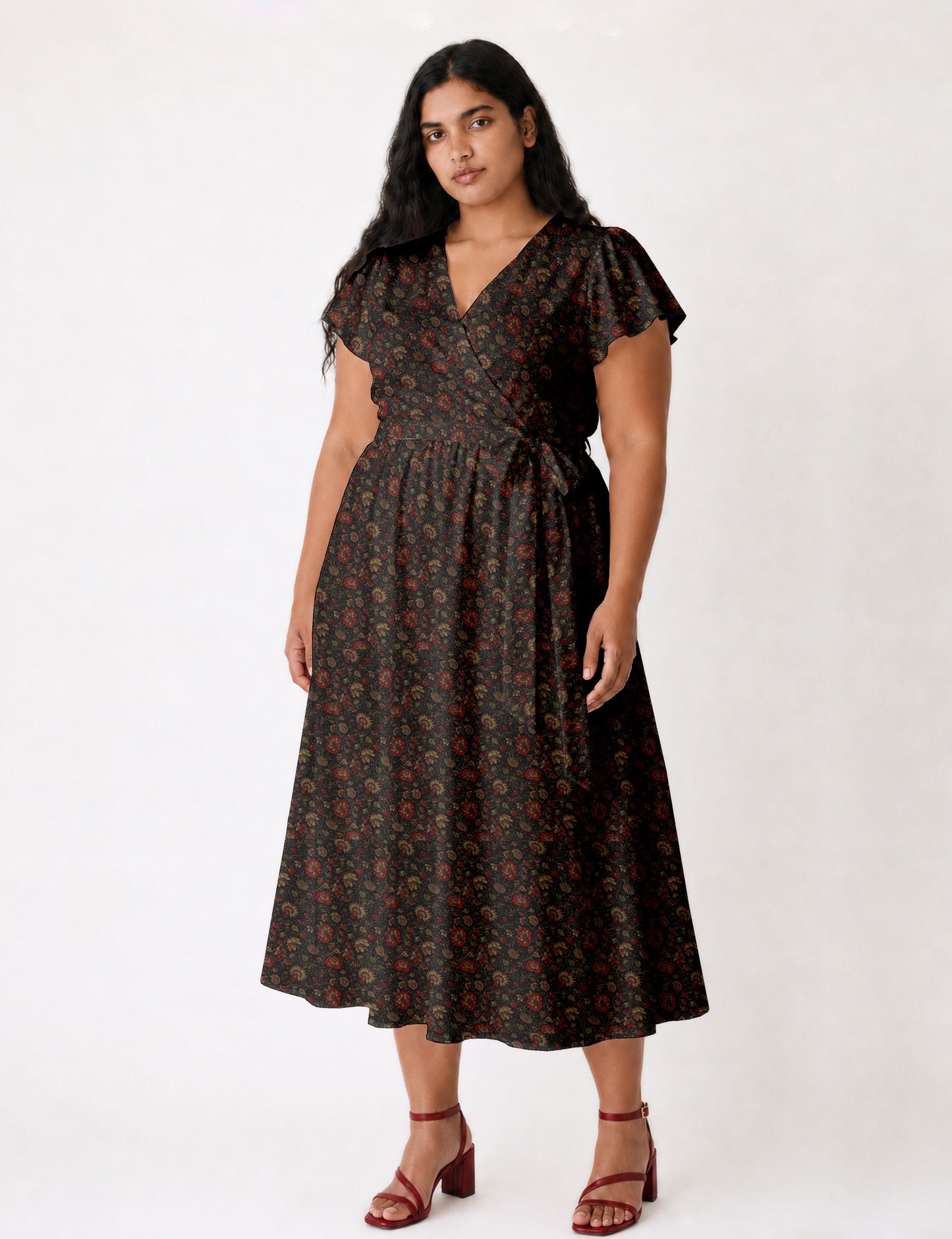 Elegant midi wrap dress with a V-neckline, adjustable waist tie, fitted bodice, and flared skirt for a timeless, flattering silhouette.