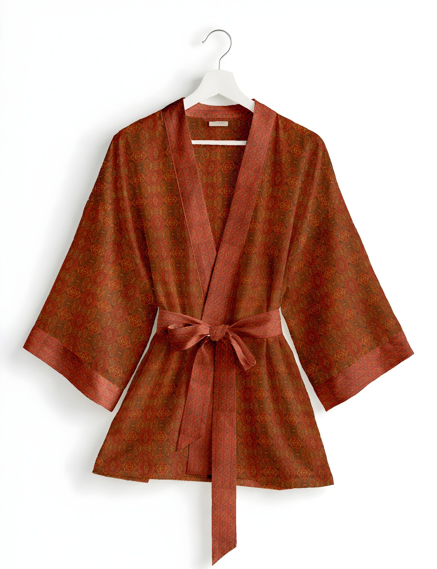 Short kimono robe with wrap front, V-neckline, wide sleeves, waist tie, and concealed skort detail.
