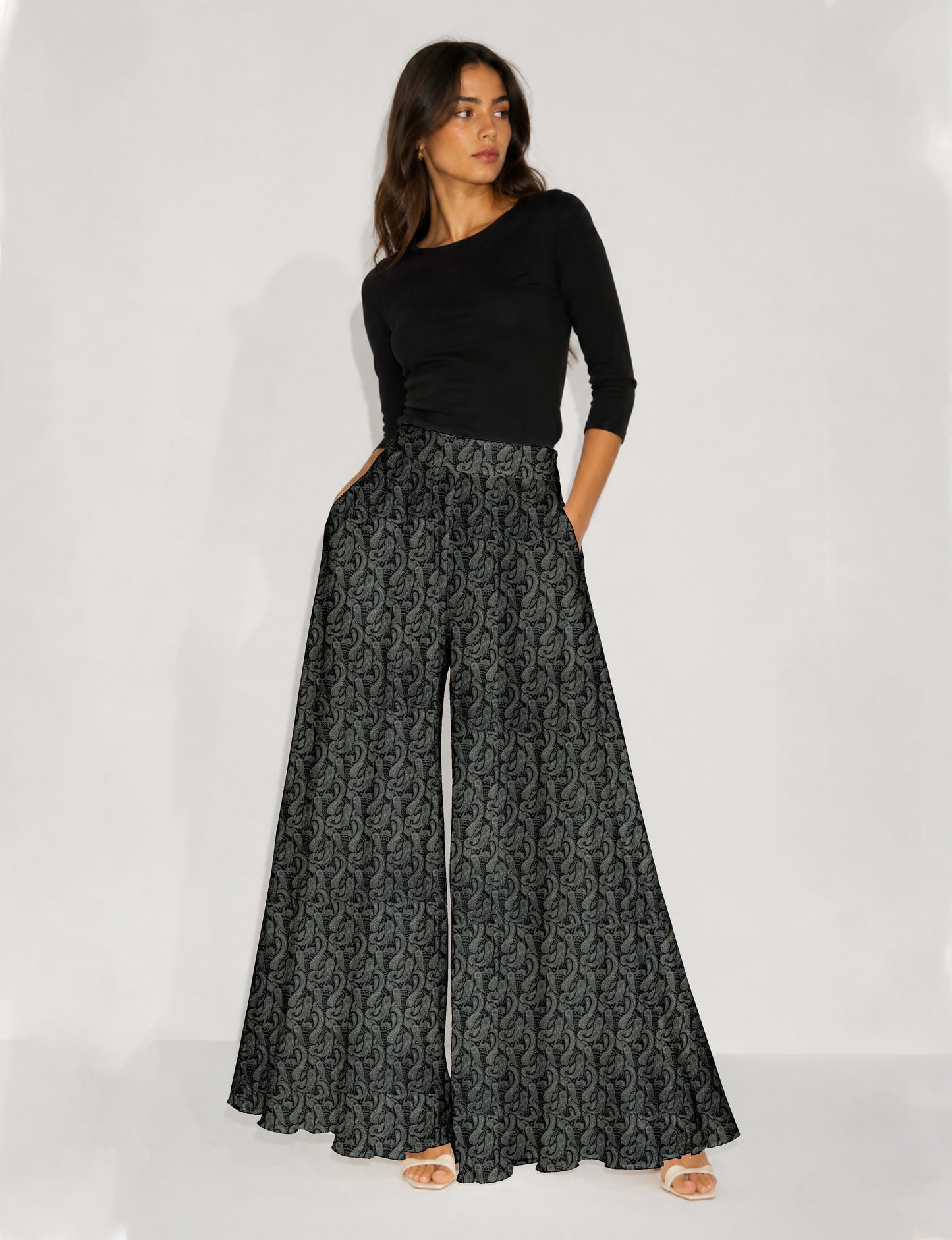 Blue wide leg palazzo trousers with a small tropical floral pattern, flat lay front view