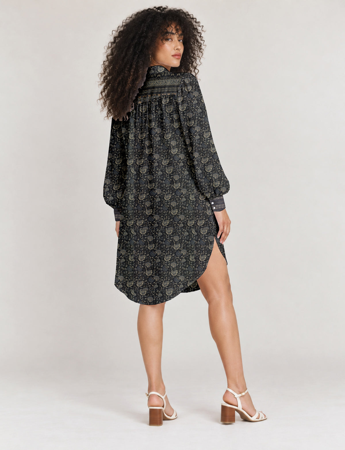 High low shirt with a relaxed fit, button-down front, classic collar, gathered shoulders and full-length blouson sleeves.