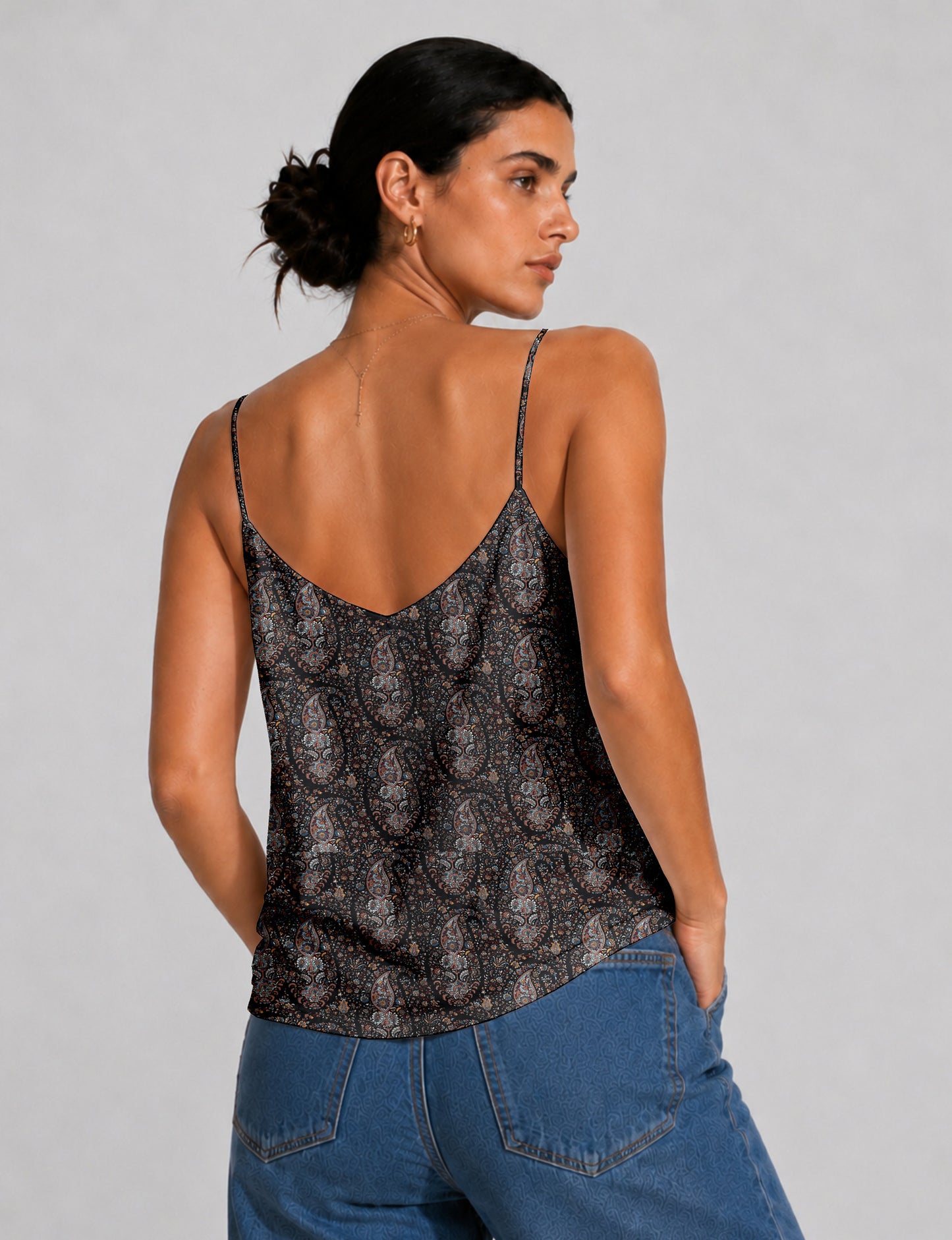 Women's sleeveless slip top with a relaxed straight fit, soft V-neckline, deep V-back, and delicate spaghetti straps.