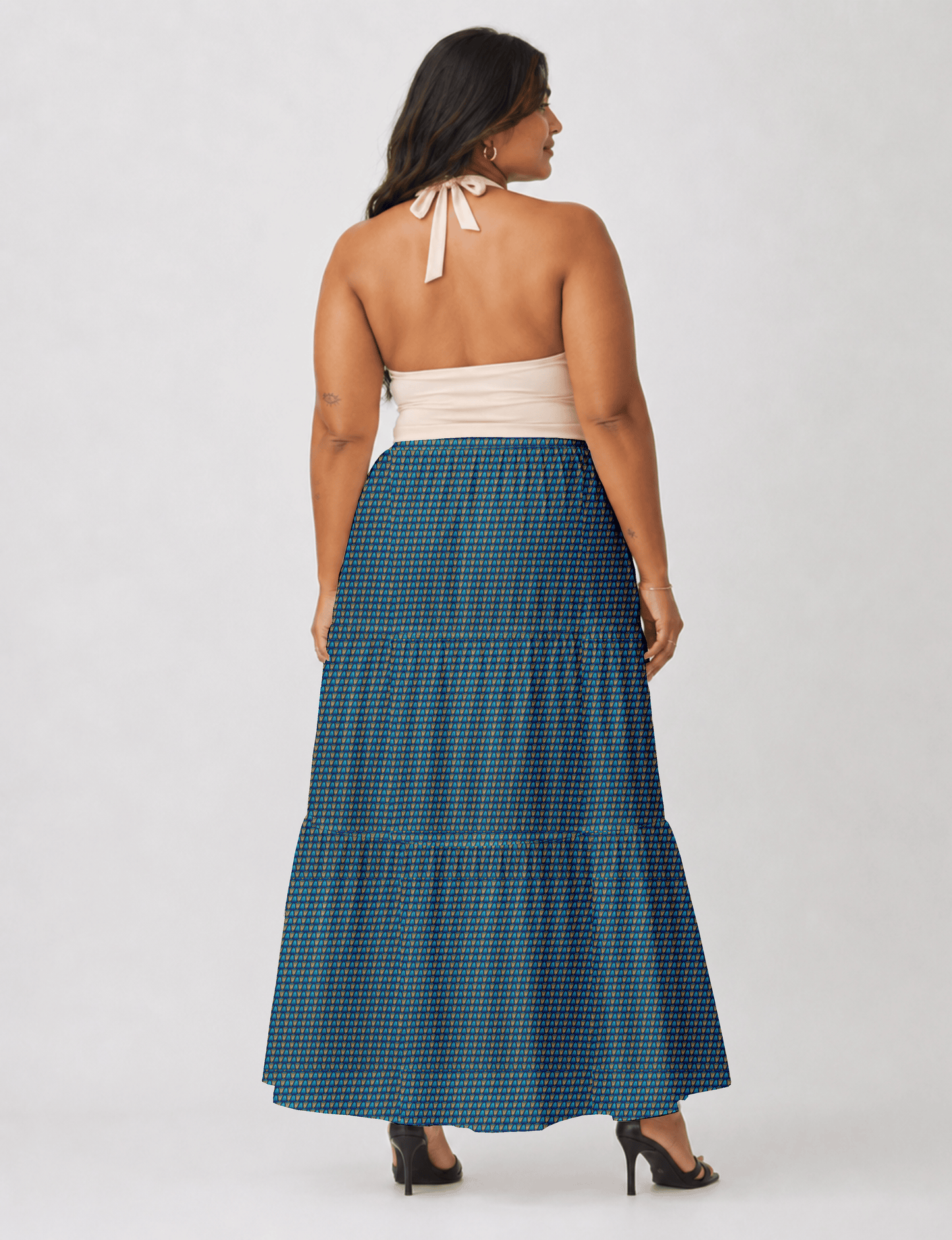 Yellow midi tiered skirt with small dark geometric micro pattern, flat lay front view