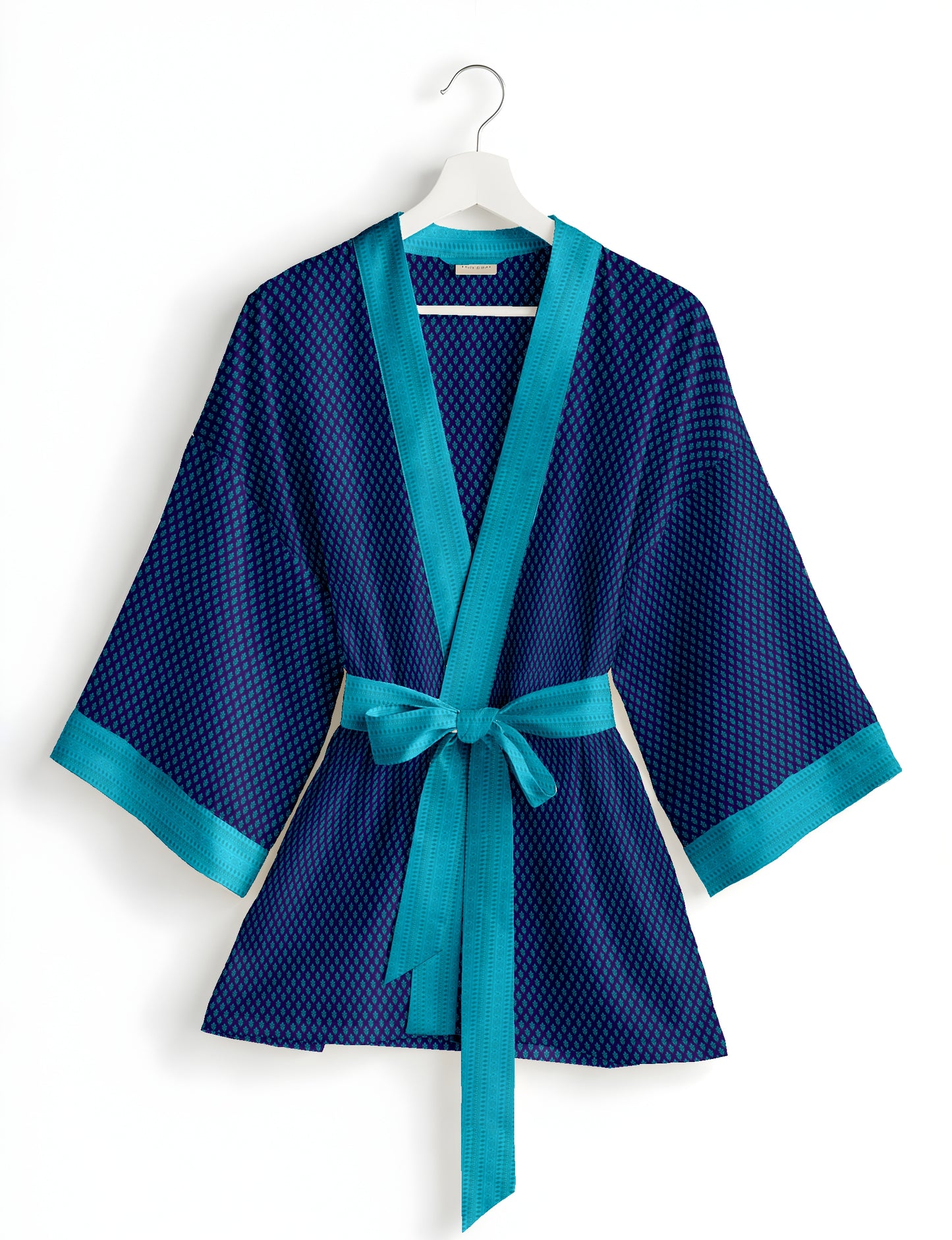 Short kimono robe with wrap front, V-neckline, wide sleeves, waist tie, and concealed skort detail.