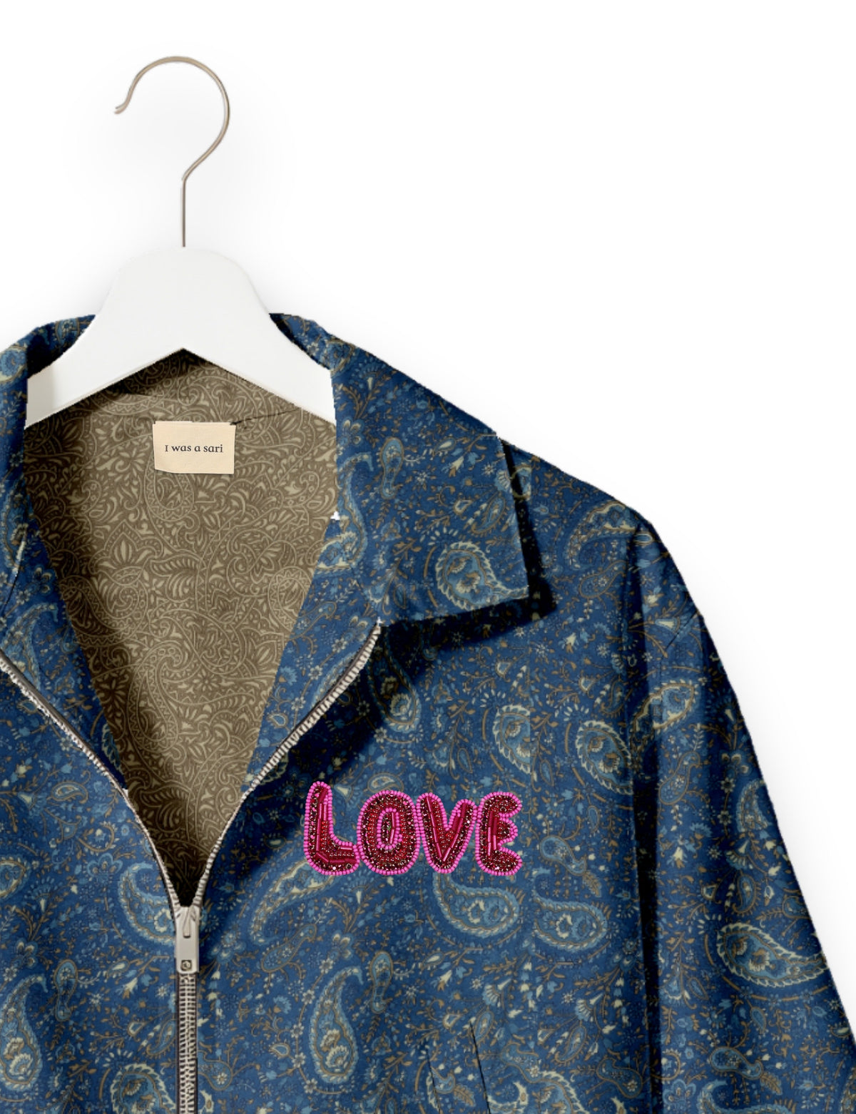 Love Bomber Jacket made from recycled fabric, featuring hand-stitched Aari embroidery. A unique piece of zero-waste clothing, part of the circular fashion movement. Designed with upcycled materials for a stylish yet environmentally friendly clothing choice.