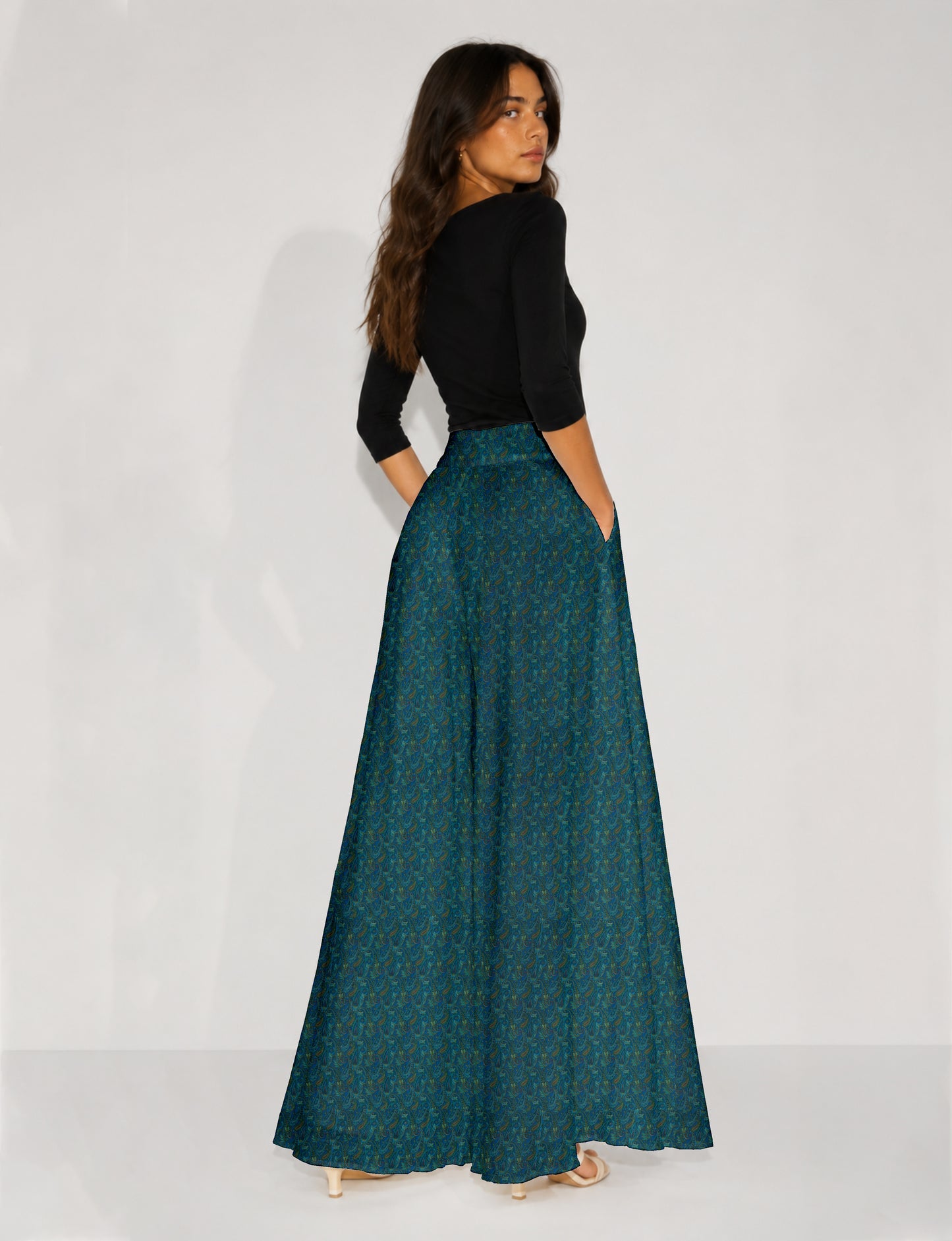 Blue wide leg palazzo trousers with a small tropical floral pattern, flat lay front view