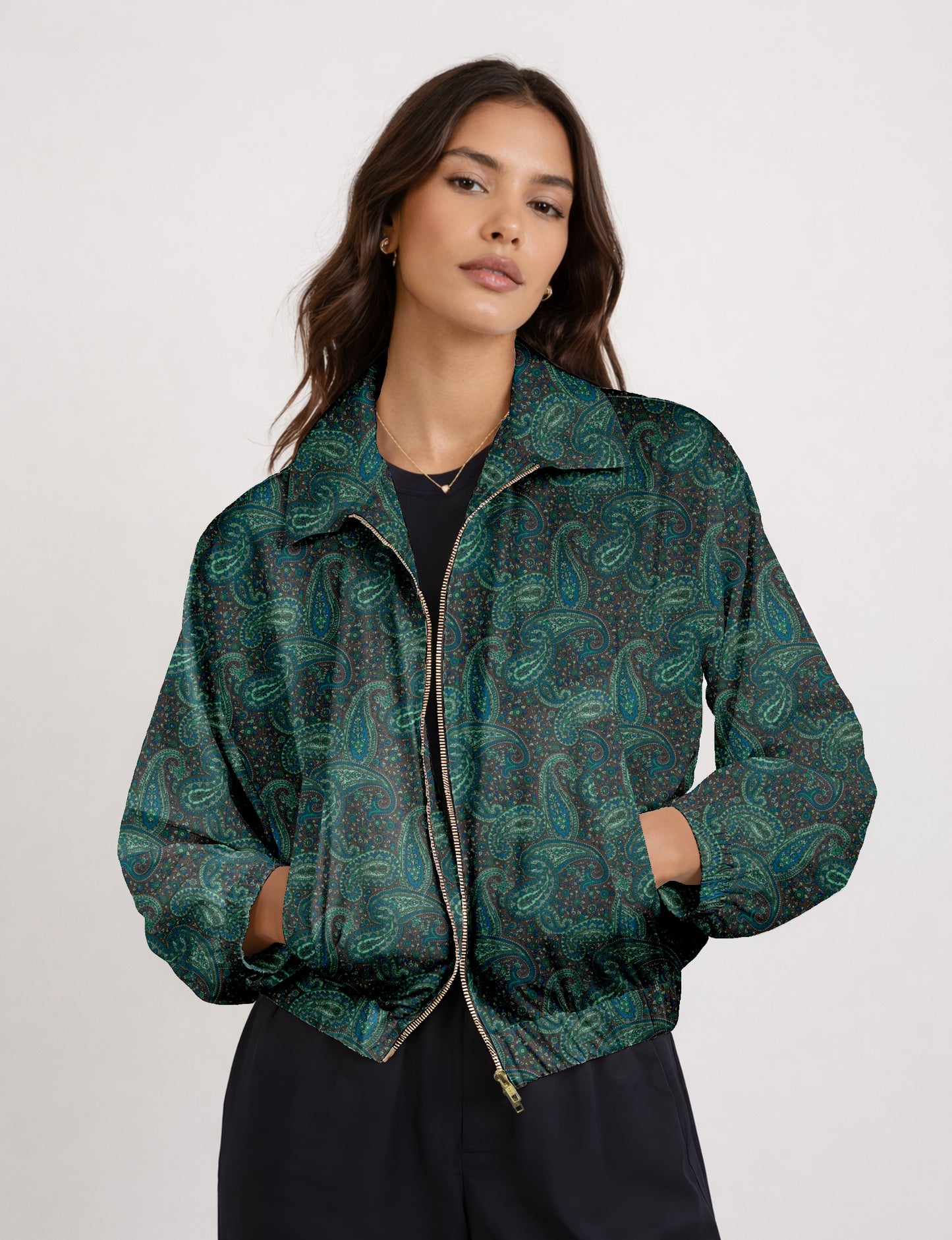 Women's cropped bomber jacket with twin metallic front zippers, welt pockets, elasticated hem and cuffs, and contrast sari print lining.