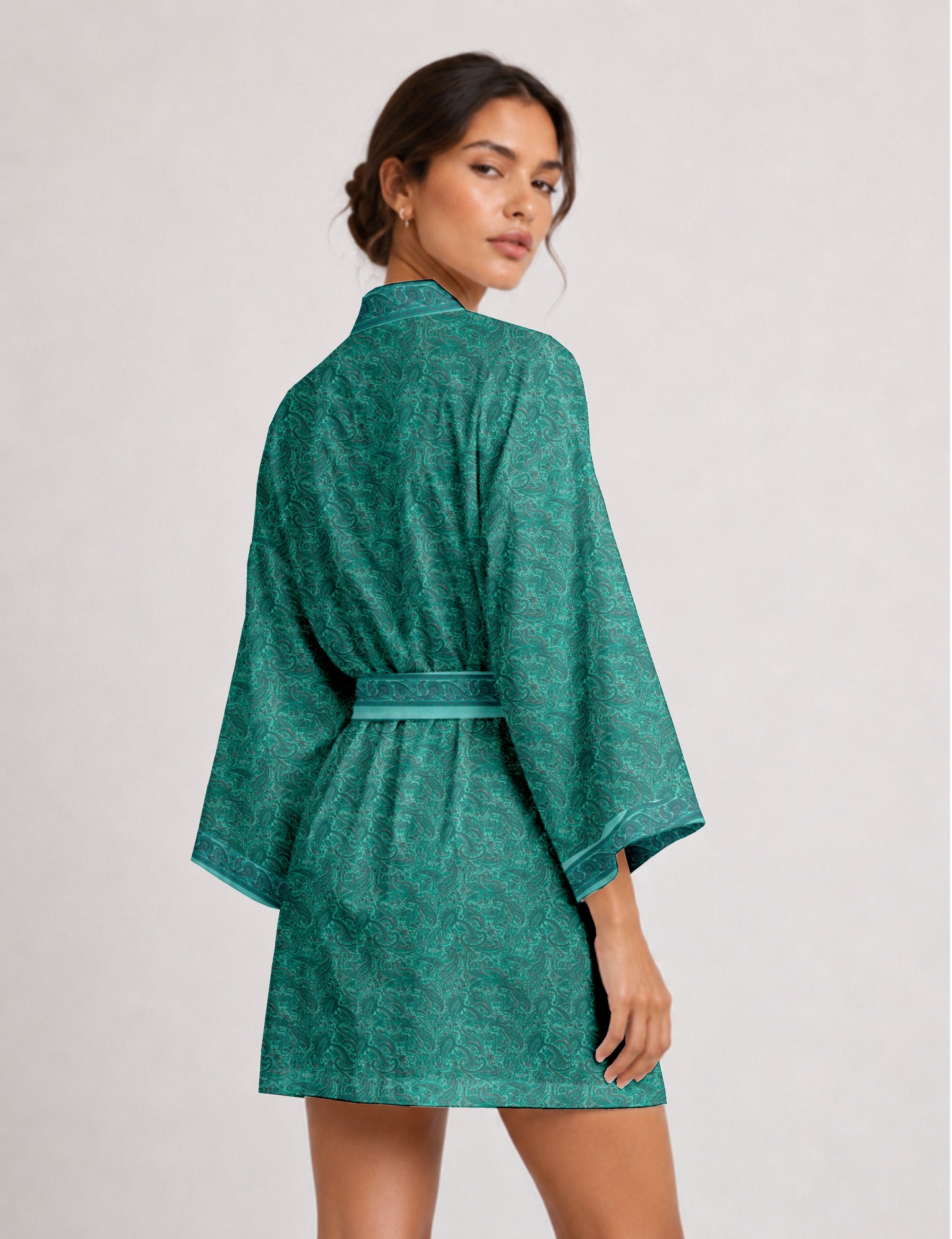 Short kimono robe with wrap front, V-neckline, wide sleeves, waist tie, and concealed skort detail.