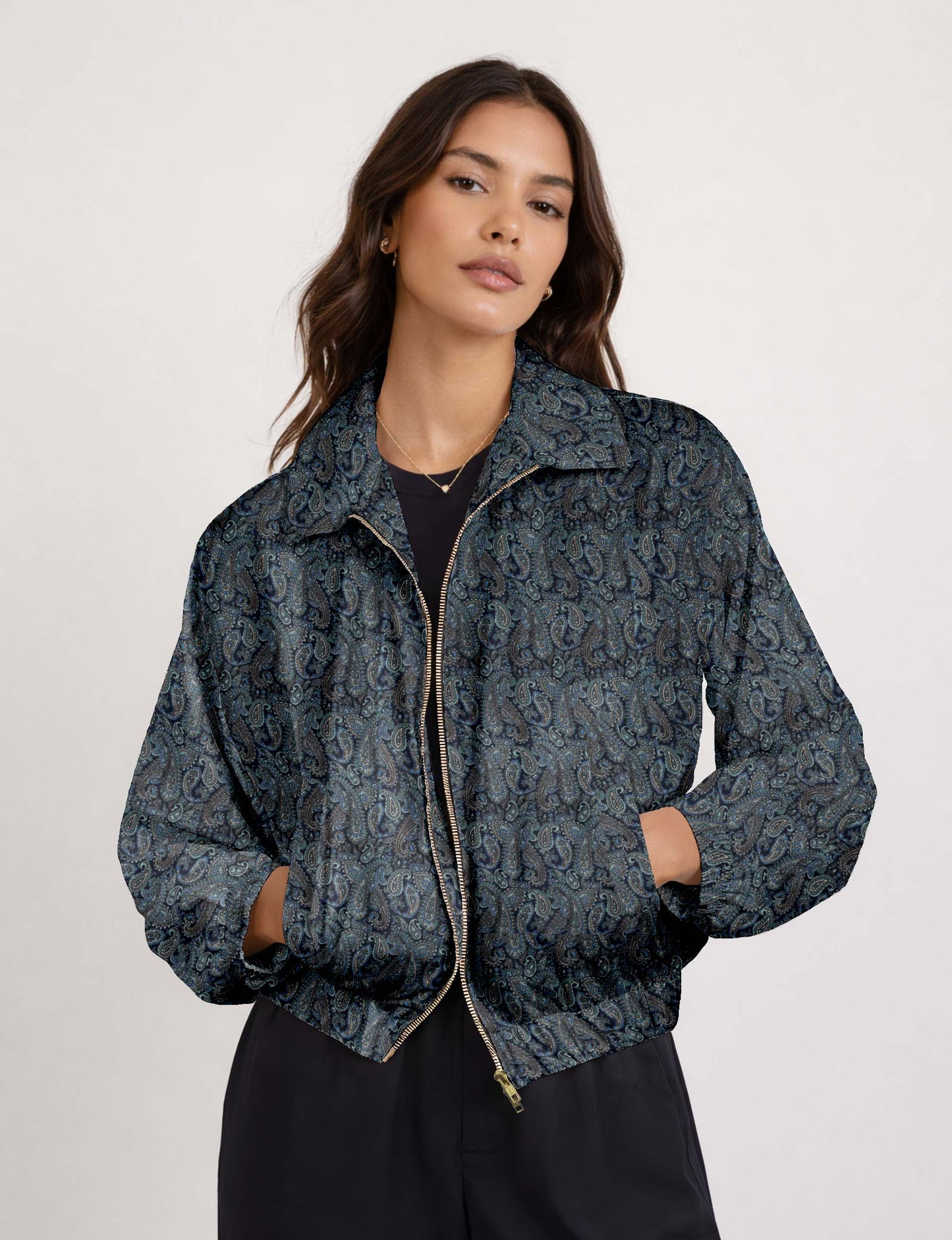 Woman wearing a yellow floral bomber jacket with front zipper, elastic cuffs, and side pockets, shown from front view