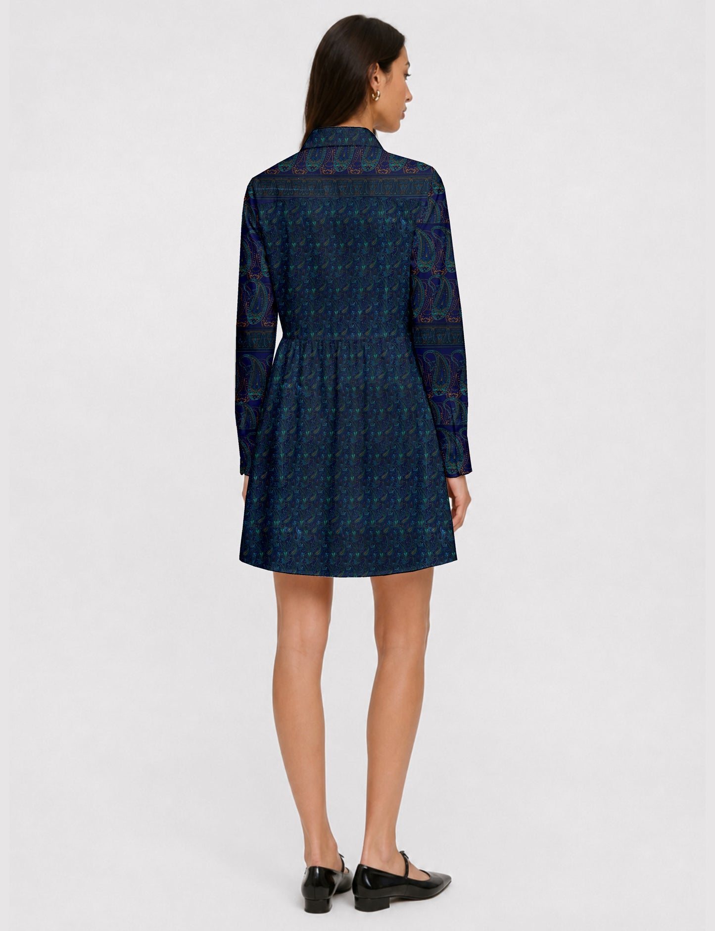 Short shirt dress with a relaxed A-line silhouette, point collar, partial button placket, gathered waist, side pockets, and full-length cuffed sleeves.