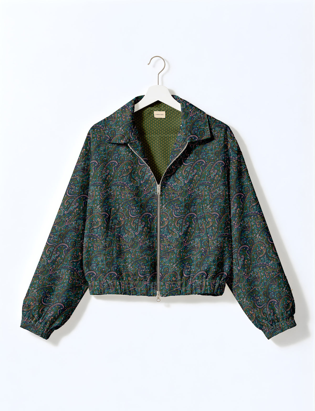 Brown floral bomber jacket with front zipper, elastic cuffs and hem, hanging on white hanger, red floral inner lining visible