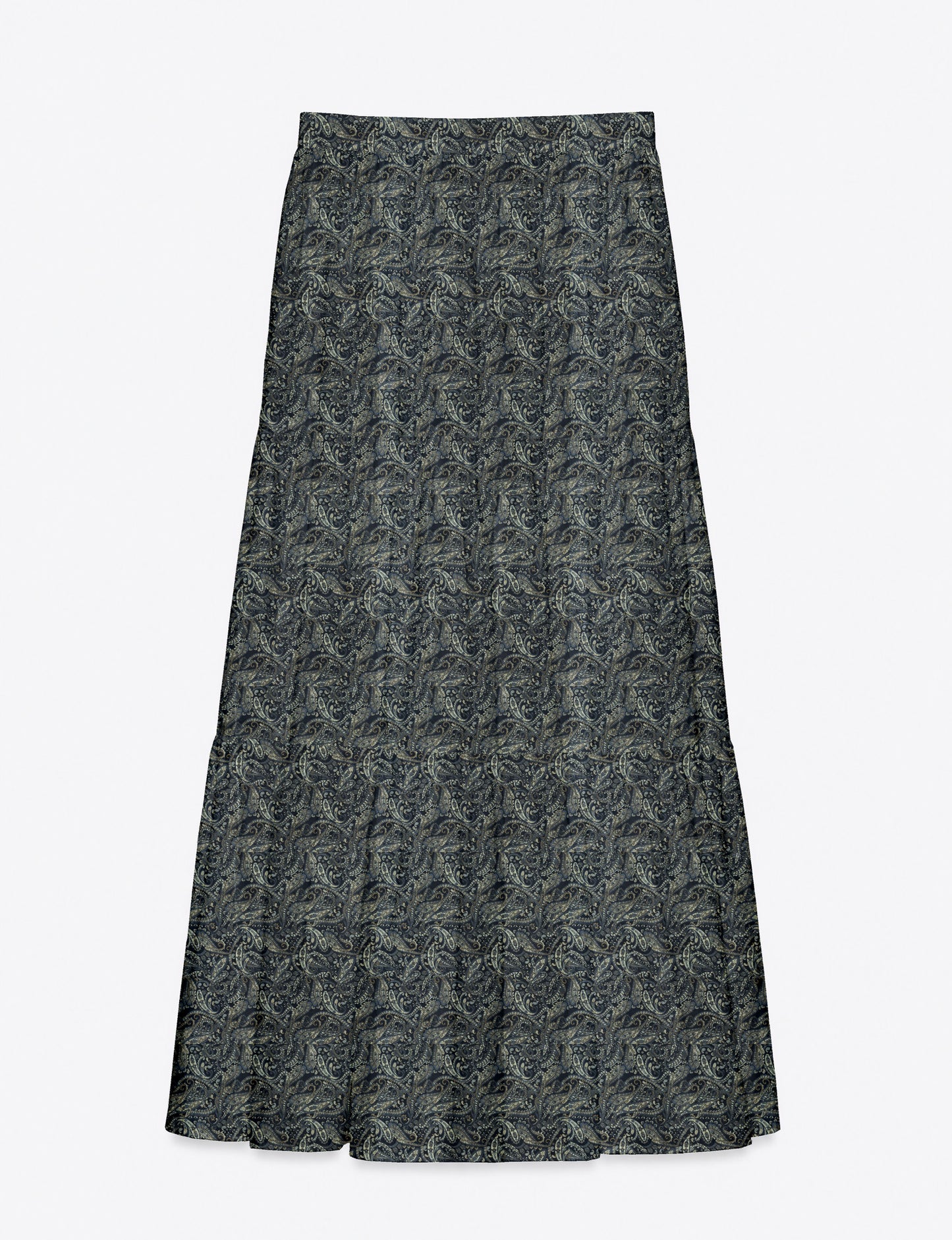 Woman wearing a yellow midi tiered skirt with a small geometric pattern, shown from the back, paired with beige top and