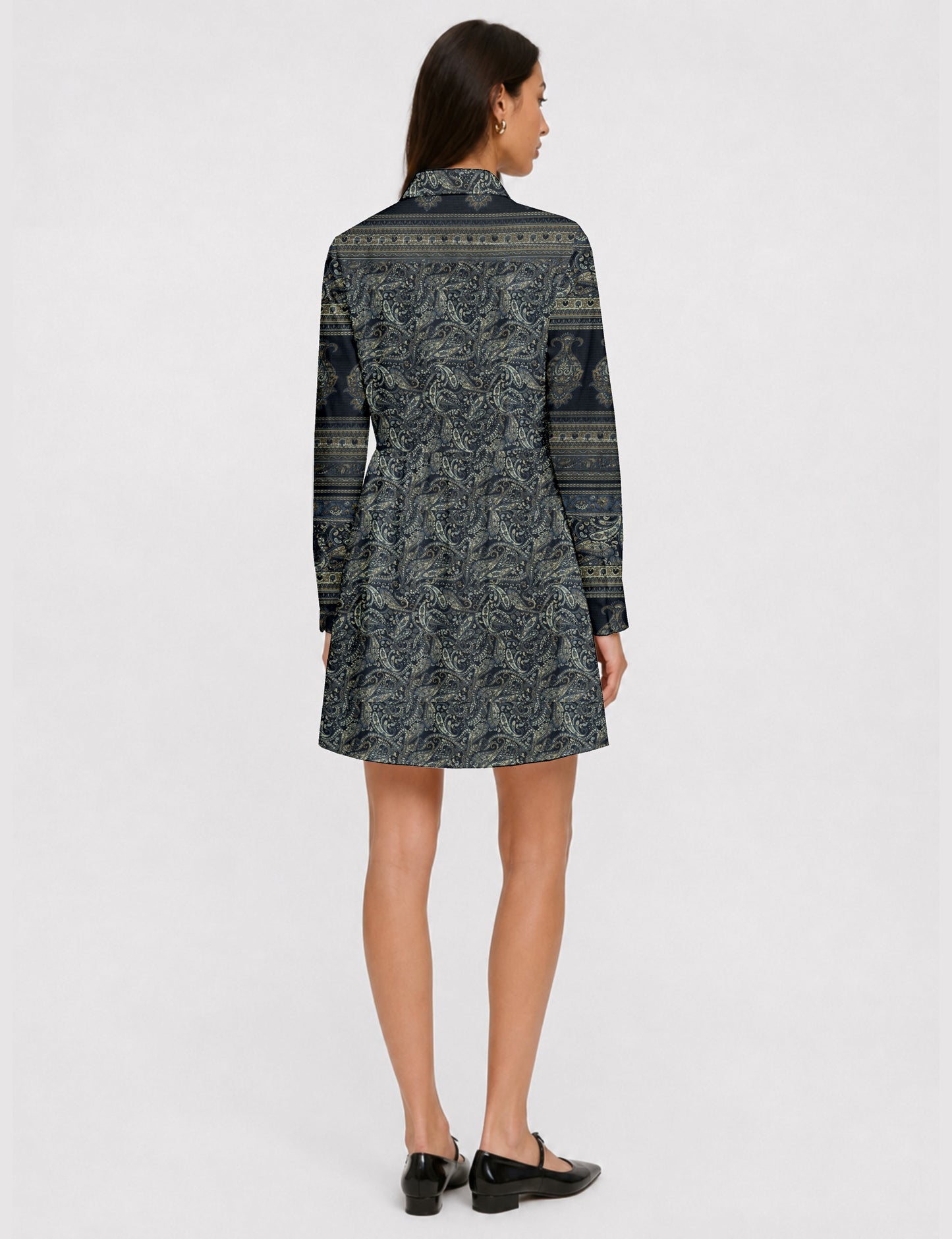 Short shirt dress with a relaxed A-line silhouette, point collar, partial button placket, gathered waist, side pockets, and full-length cuffed sleeves.