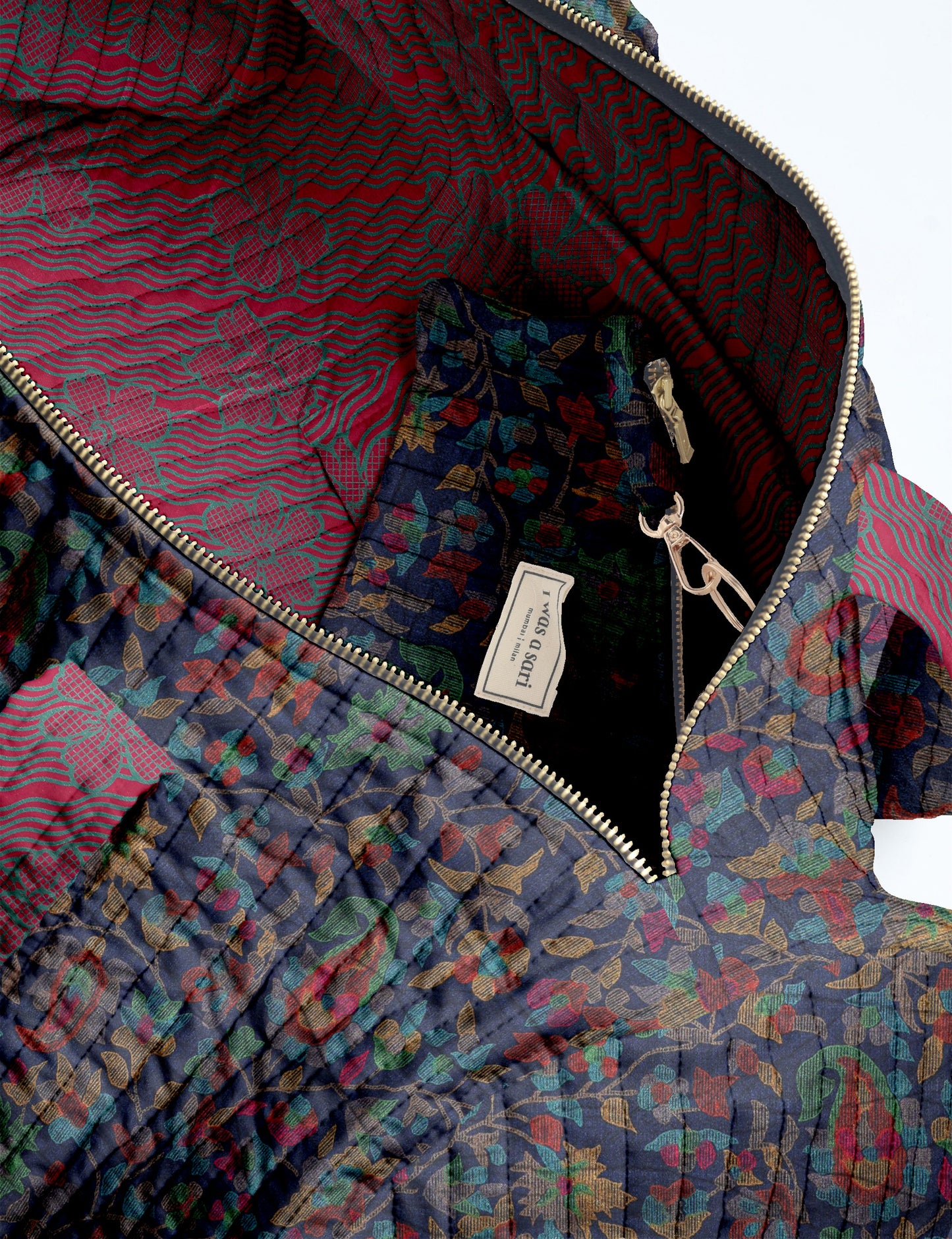 Brown paisley quilted bowling bag with dual handles, front zipper pocket, and "I was a sari" label on front side