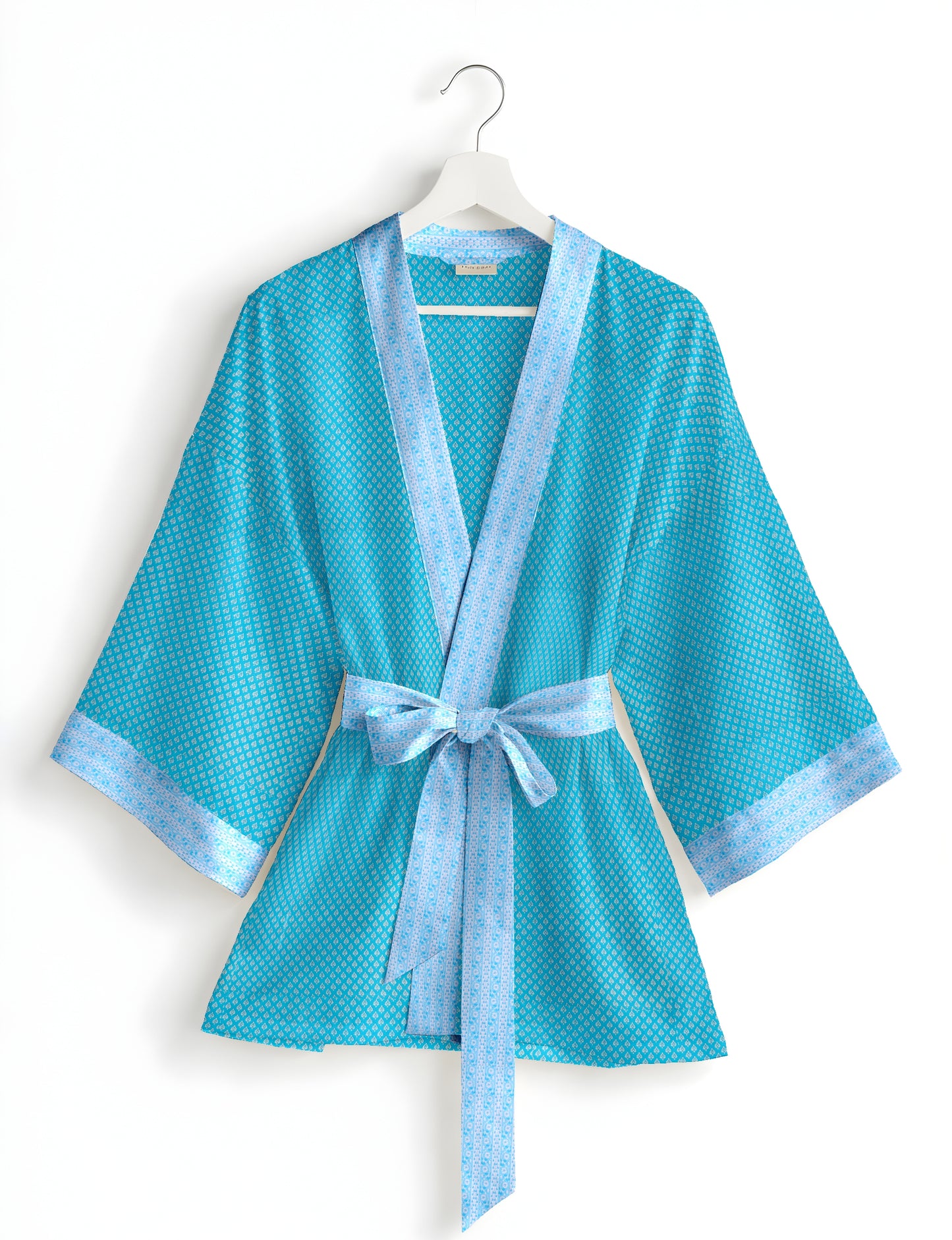 Short kimono robe with wrap front, V-neckline, wide sleeves, waist tie, and concealed skort detail.