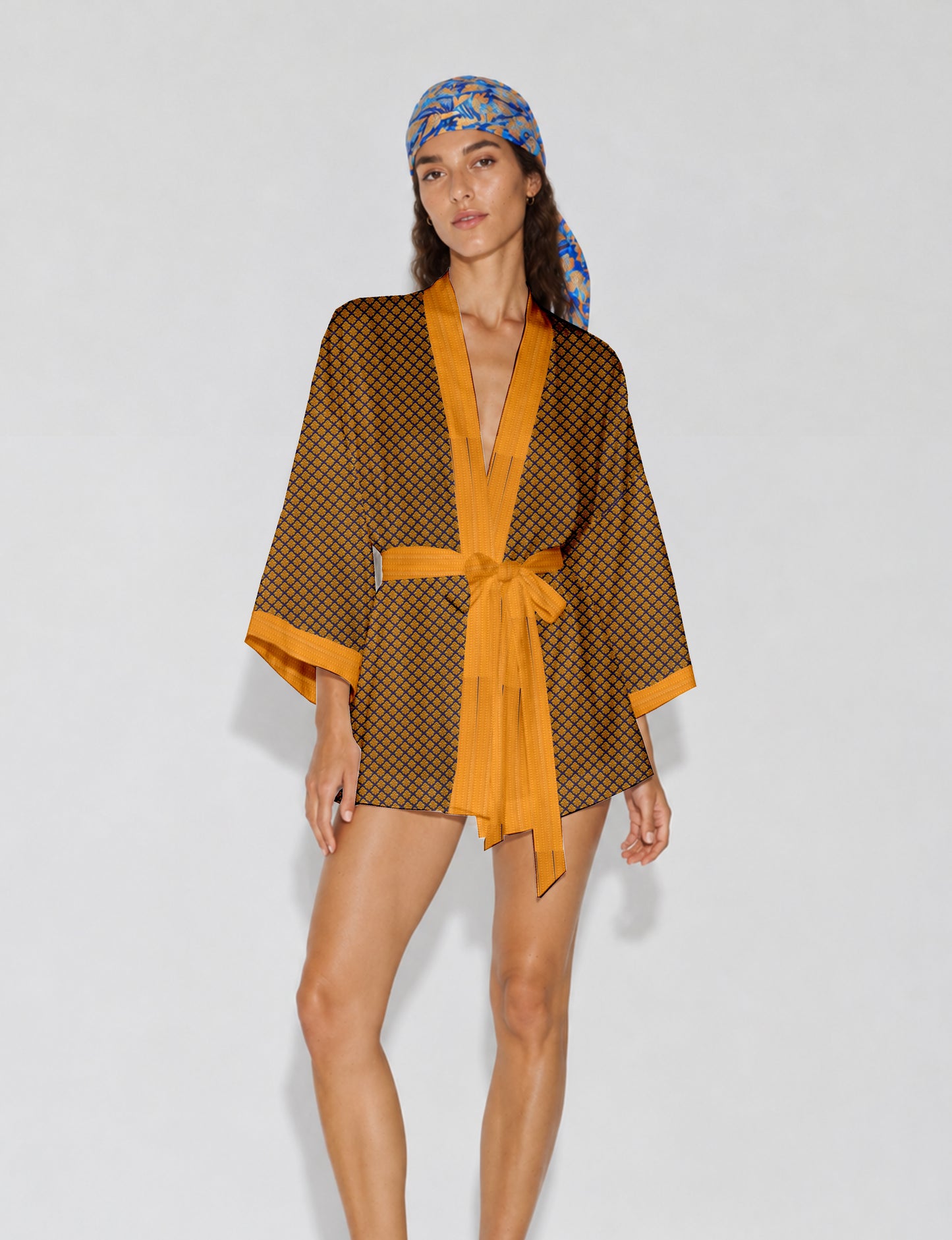 Short kimono robe with wrap front, V-neckline, wide sleeves, waist tie, and concealed skort detail.