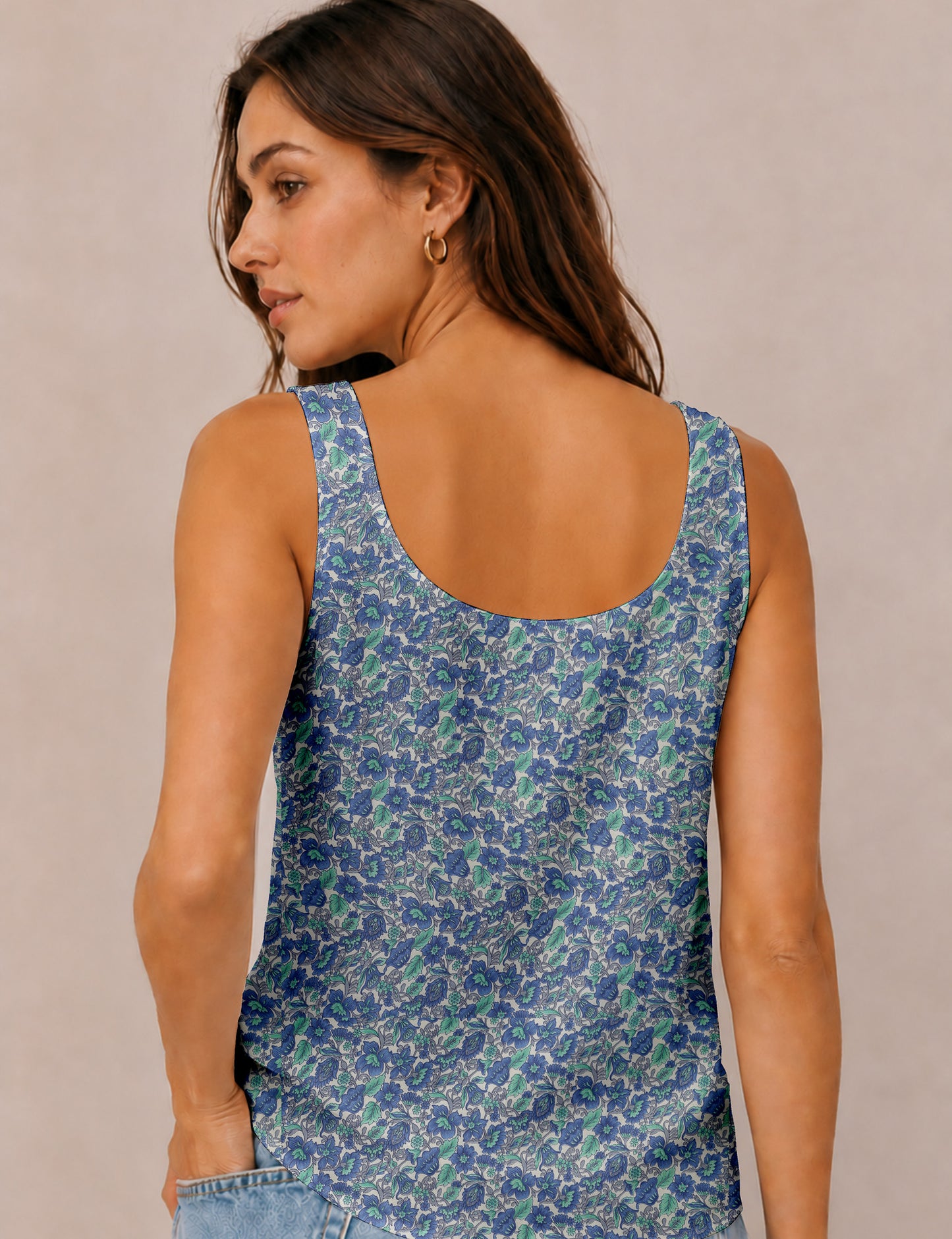 Women's sleeveless blouse with a relaxed straight fit, wide scoop neckline, deep scoop back, and hip-length silhouette.