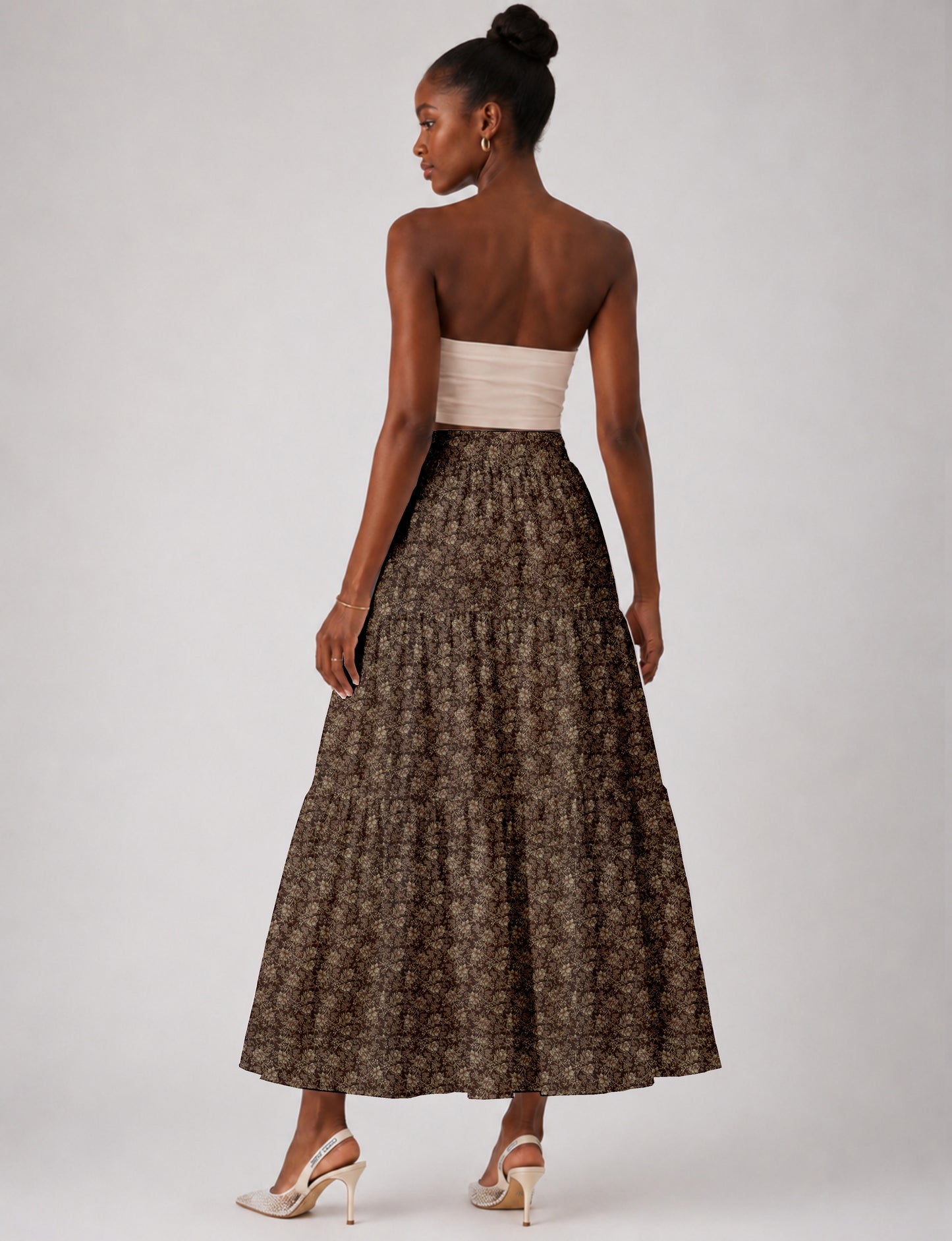 Yellow midi tiered skirt with small dark geometric micro pattern, flat lay front view