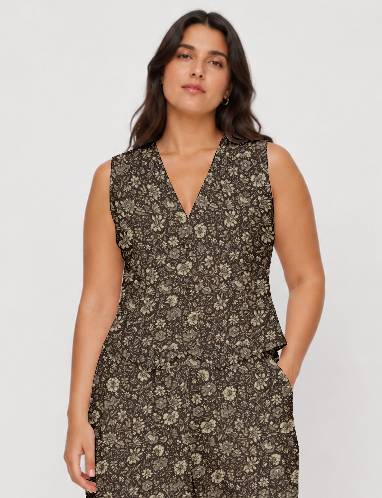 Women's fitted waistcoat with V-neck, single-breasted button closure, tailored silhouette, and pointed hem in sustainable fashion.