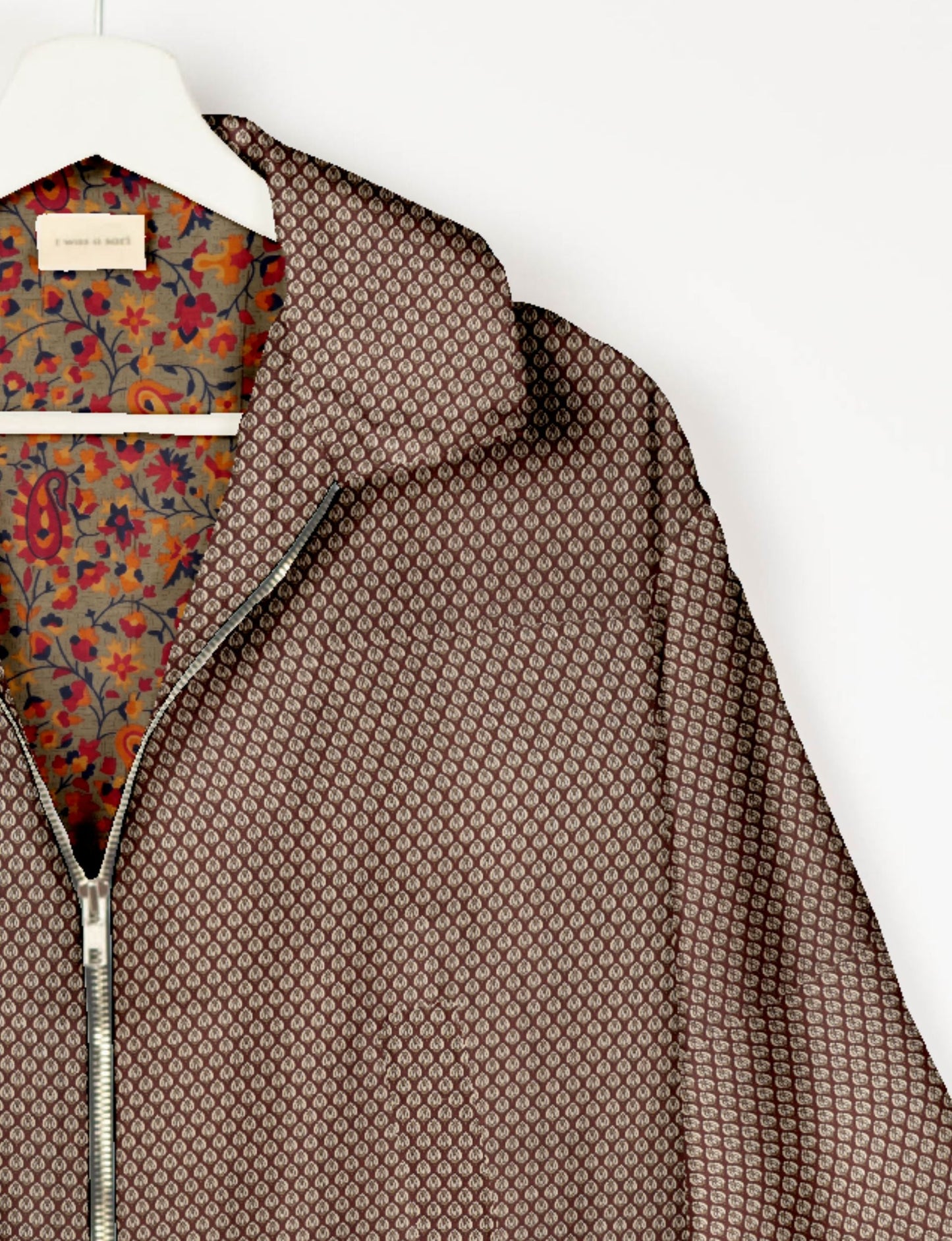 Upcycled Bomber Jacket made from recycled sari materials, featuring a cute cropped shape, elasticated hem and cuffs, and contrast sari print lining. Sustainable apparel promoting eco-friendly fashion and ethical clothing.