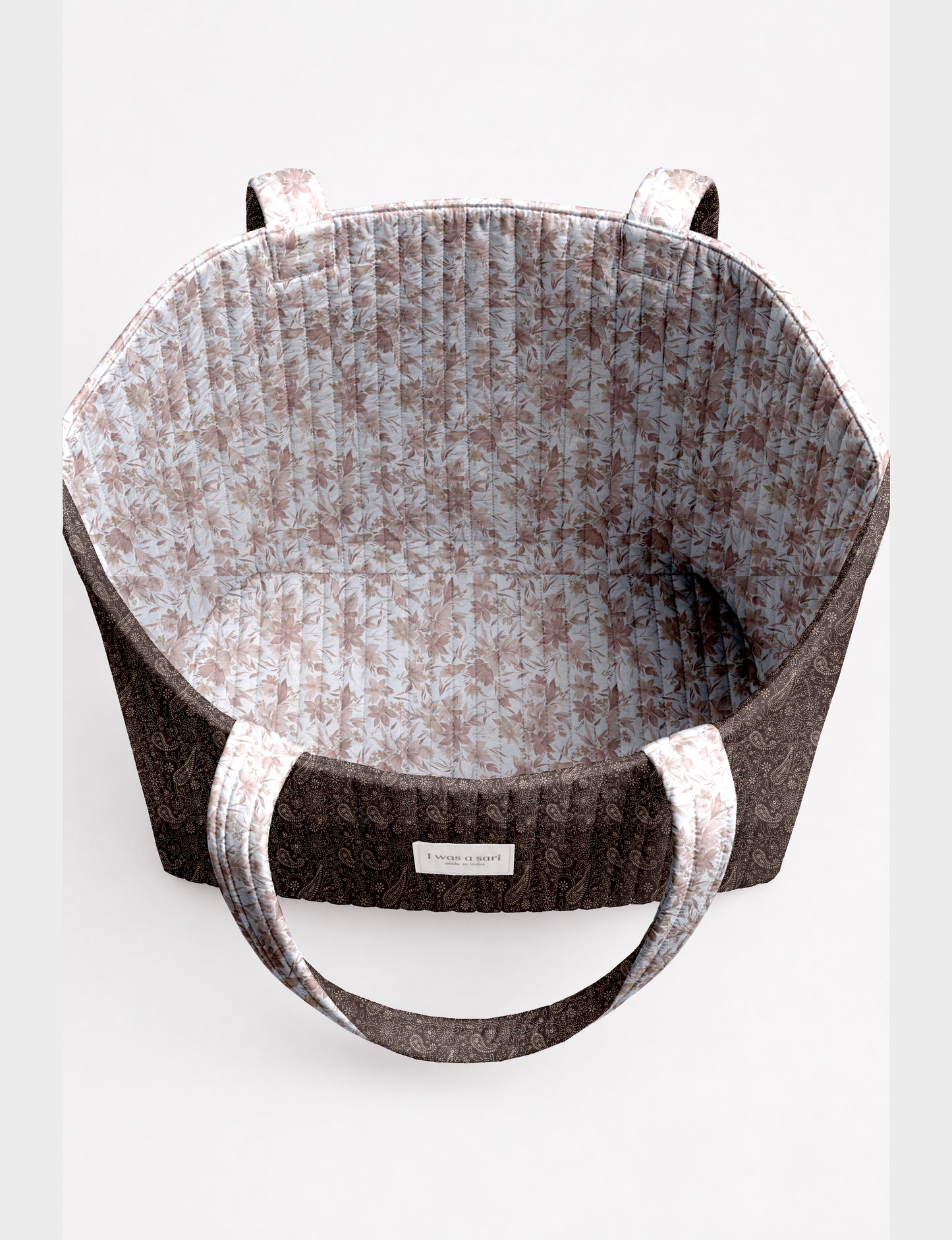 Large quilted beach bag with spacious rectangular design, reinforced shoulder straps, and open-top construction for everyday use and travel.