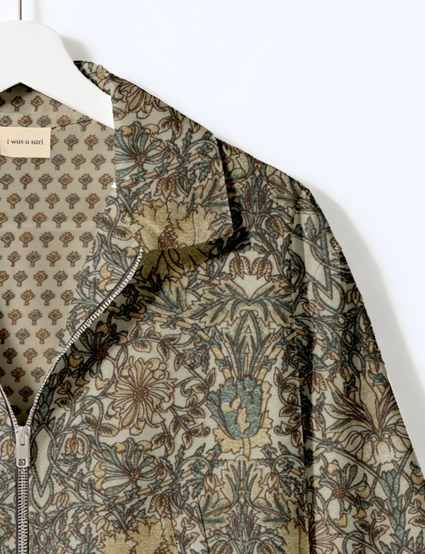 Upcycled Bomber Jacket made from recycled sari materials, featuring a cute cropped shape, elasticated hem and cuffs, and contrast sari print lining. Sustainable apparel promoting eco-friendly fashion and ethical clothing.