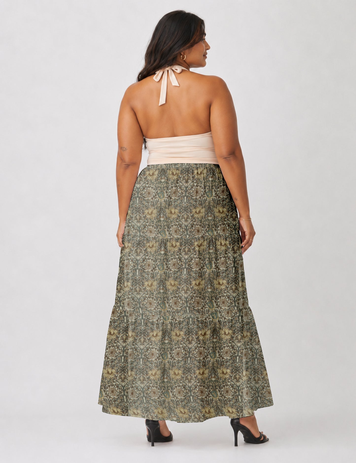 Midi tiered skirt with fitted waistband, soft knife pleats, flared silhouette, side seam pockets, and ankle-length hem