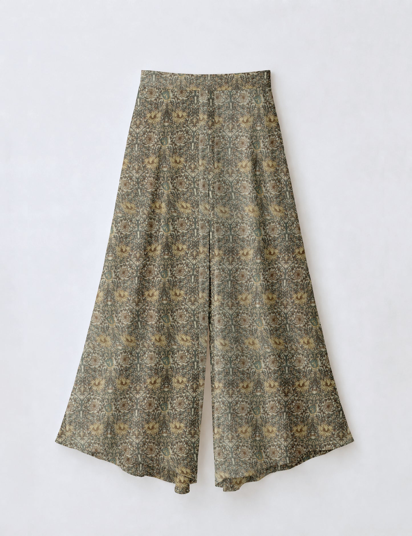 Women's wide leg palazzo trousers with a fitted waistband and relaxed flowing silhouette.