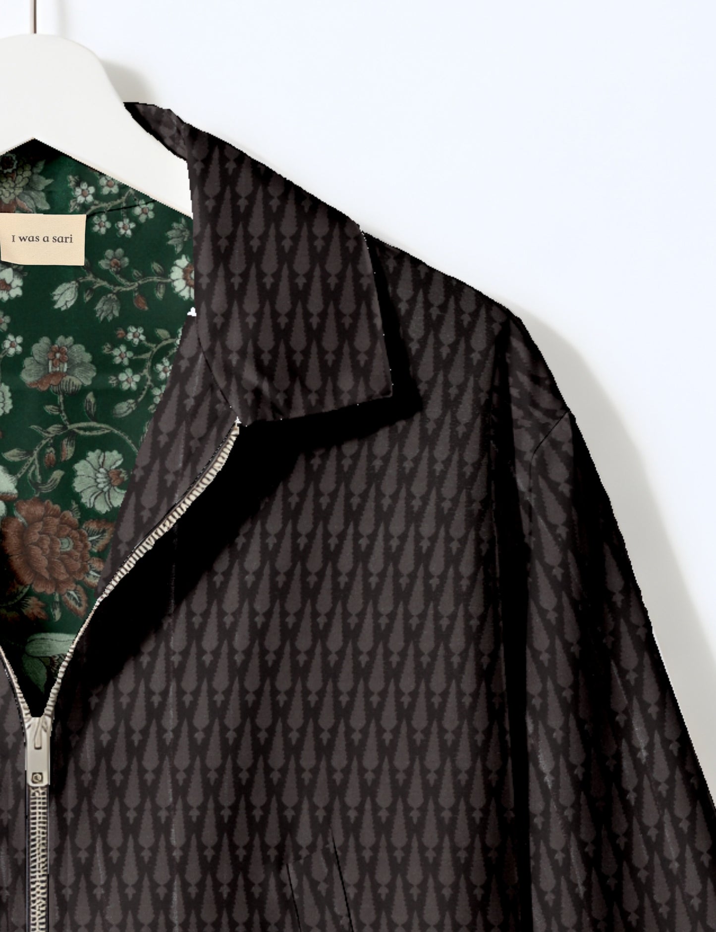 Upcycled Bomber Jacket made from recycled sari materials, featuring a cute cropped shape, elasticated hem and cuffs, and contrast sari print lining. Sustainable apparel promoting eco-friendly fashion and ethical clothing.