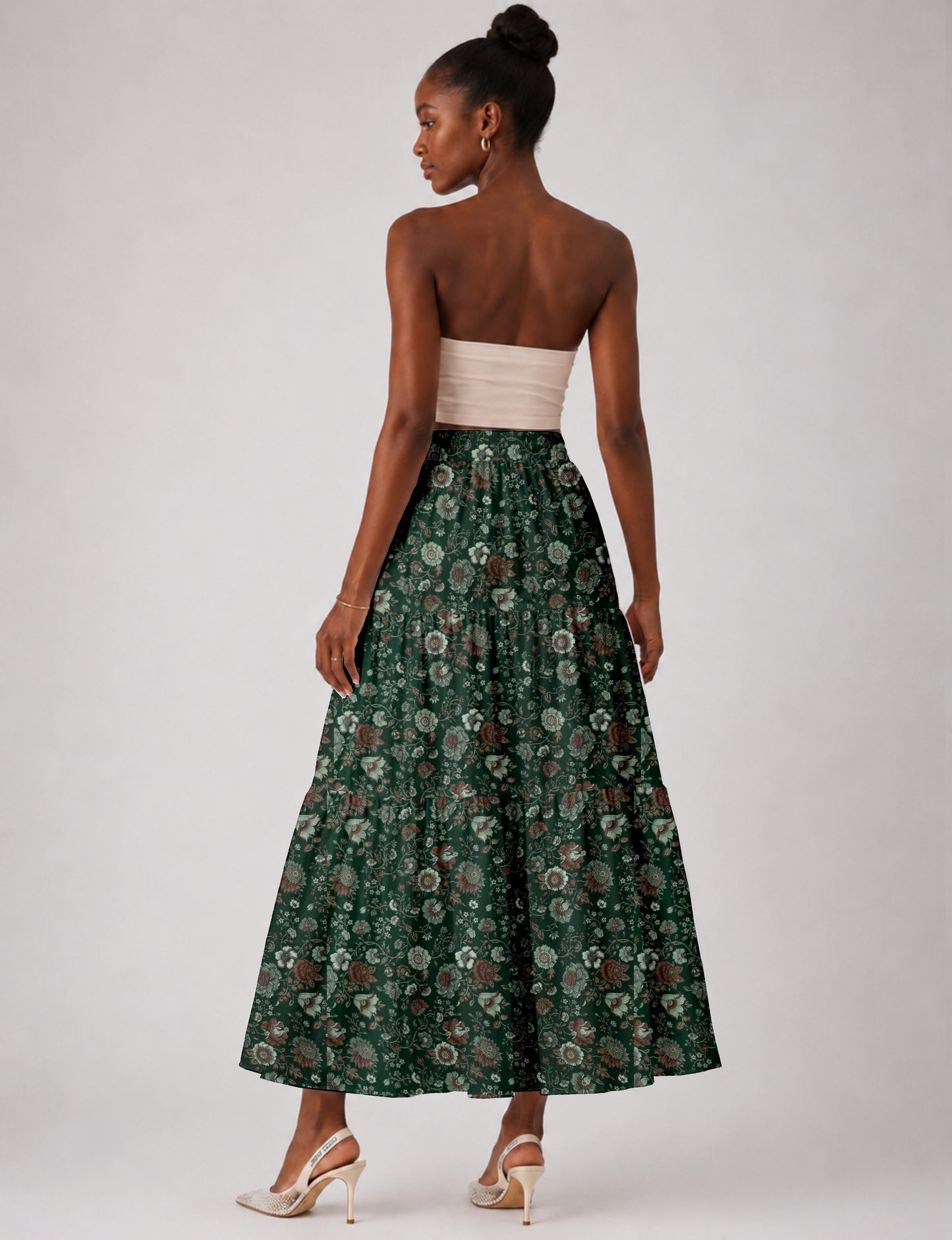Midi tiered skirt with fitted waistband, soft knife pleats, flared silhouette, side seam pockets, and ankle-length hem