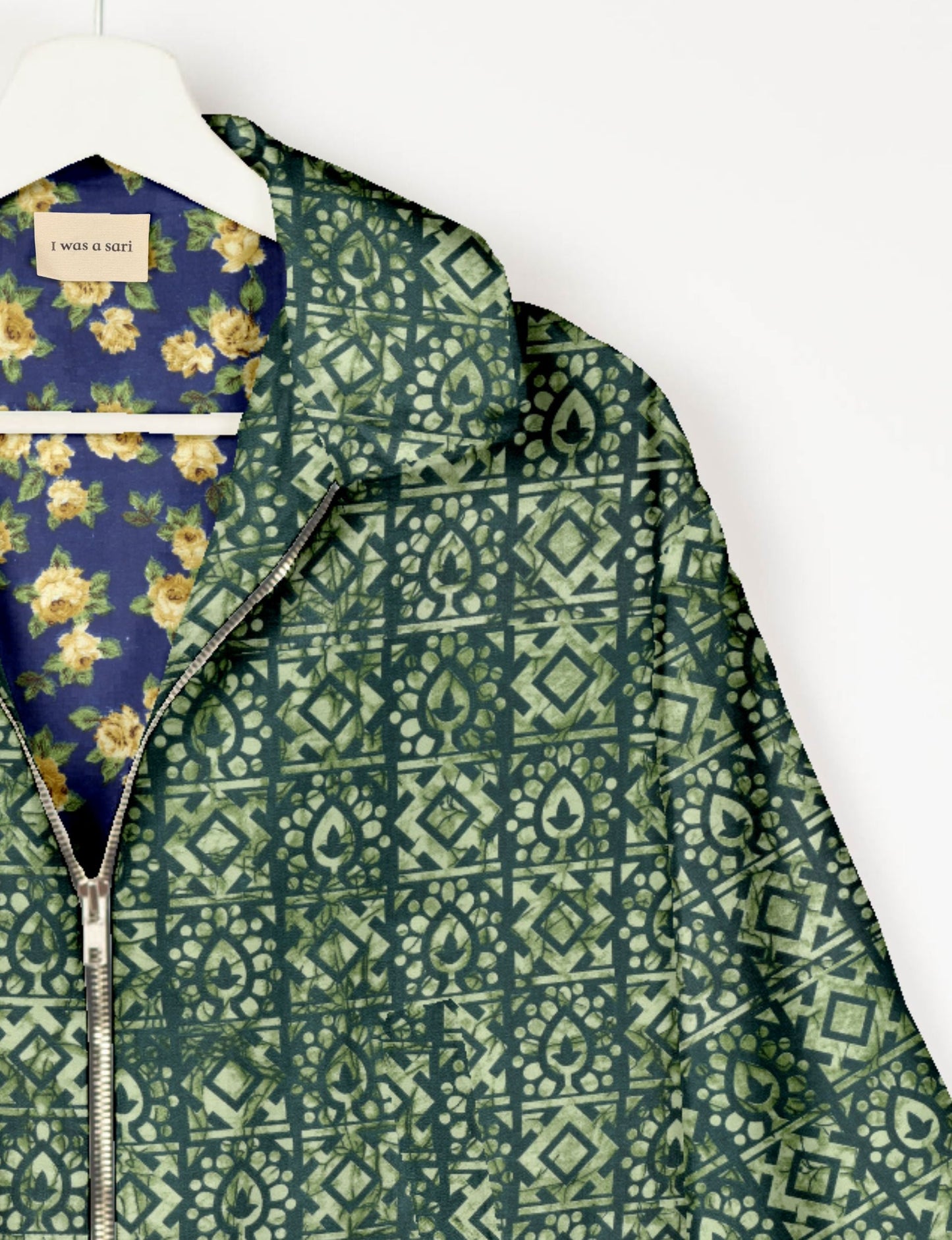 Upcycled Bomber Jacket made from recycled sari materials, featuring a cute cropped shape, elasticated hem and cuffs, and contrast sari print lining. Sustainable apparel promoting eco-friendly fashion and ethical clothing.
