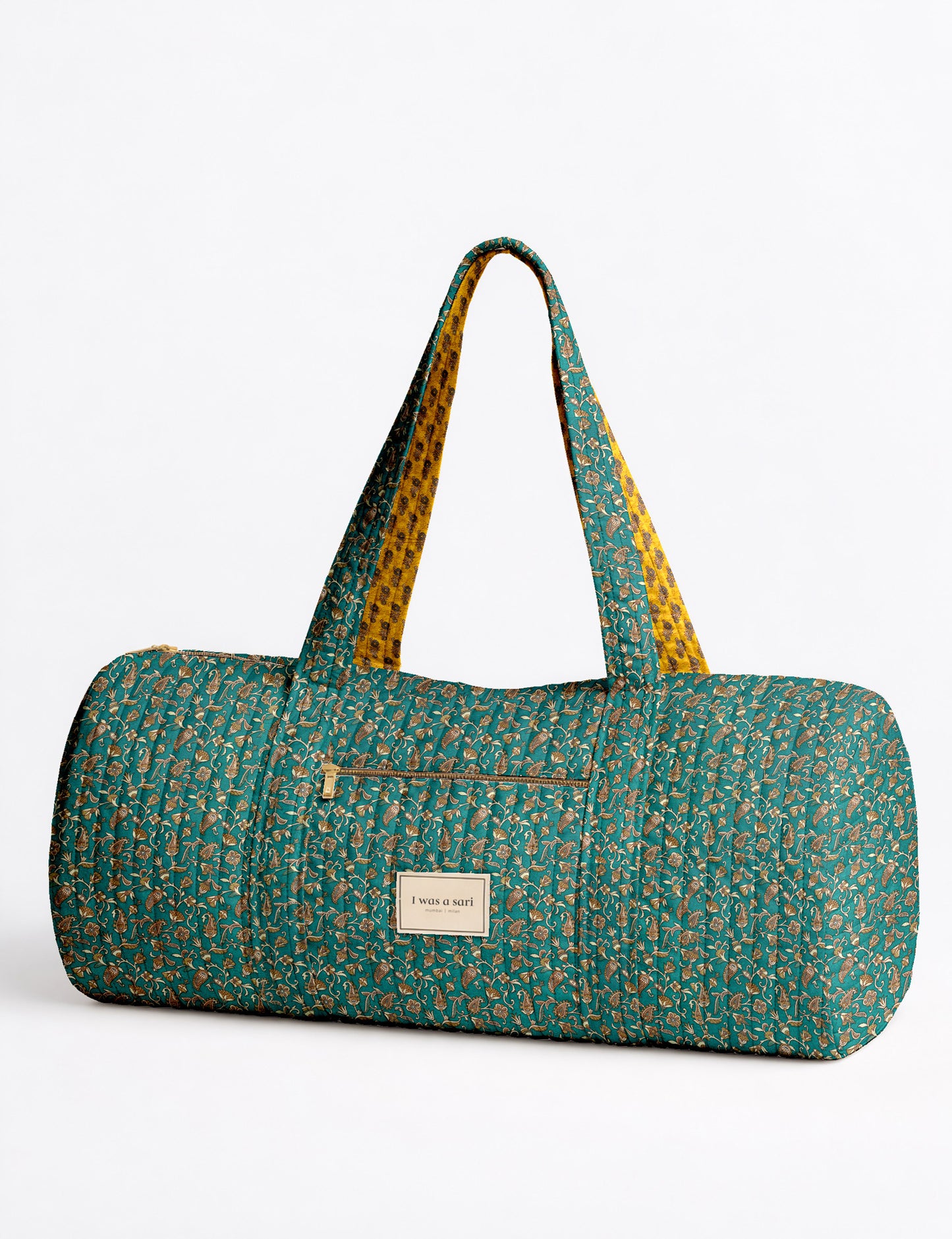 Quilted brown paisley bowling bag with gold zipper, floral interior lining, and interior key clip with label inside pocket