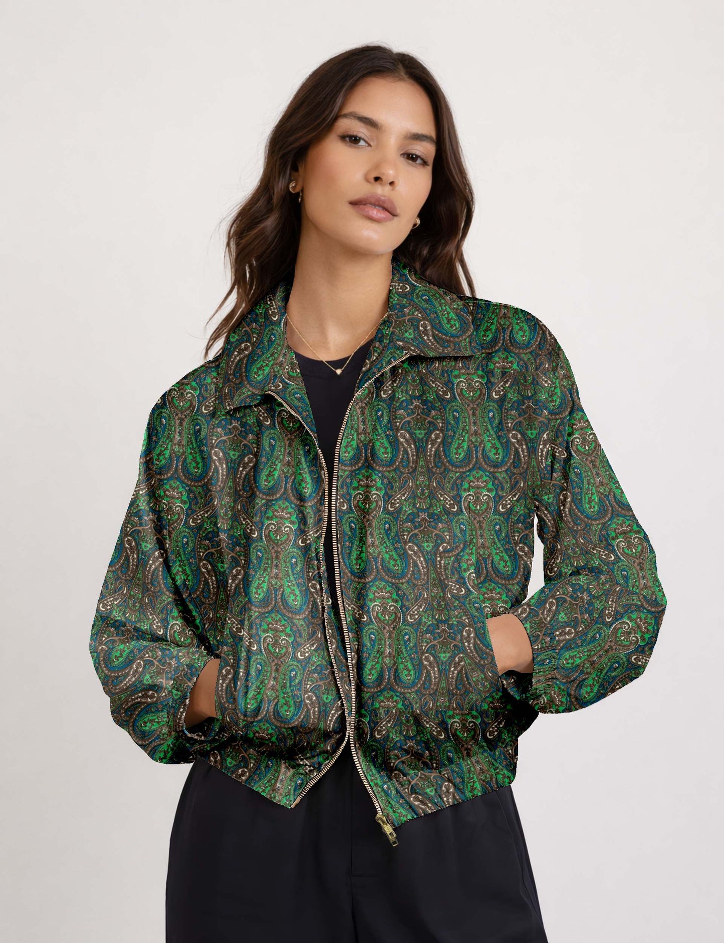 Woman wearing a yellow floral bomber jacket with front zipper, elastic cuffs, and side pockets, shown from front view
