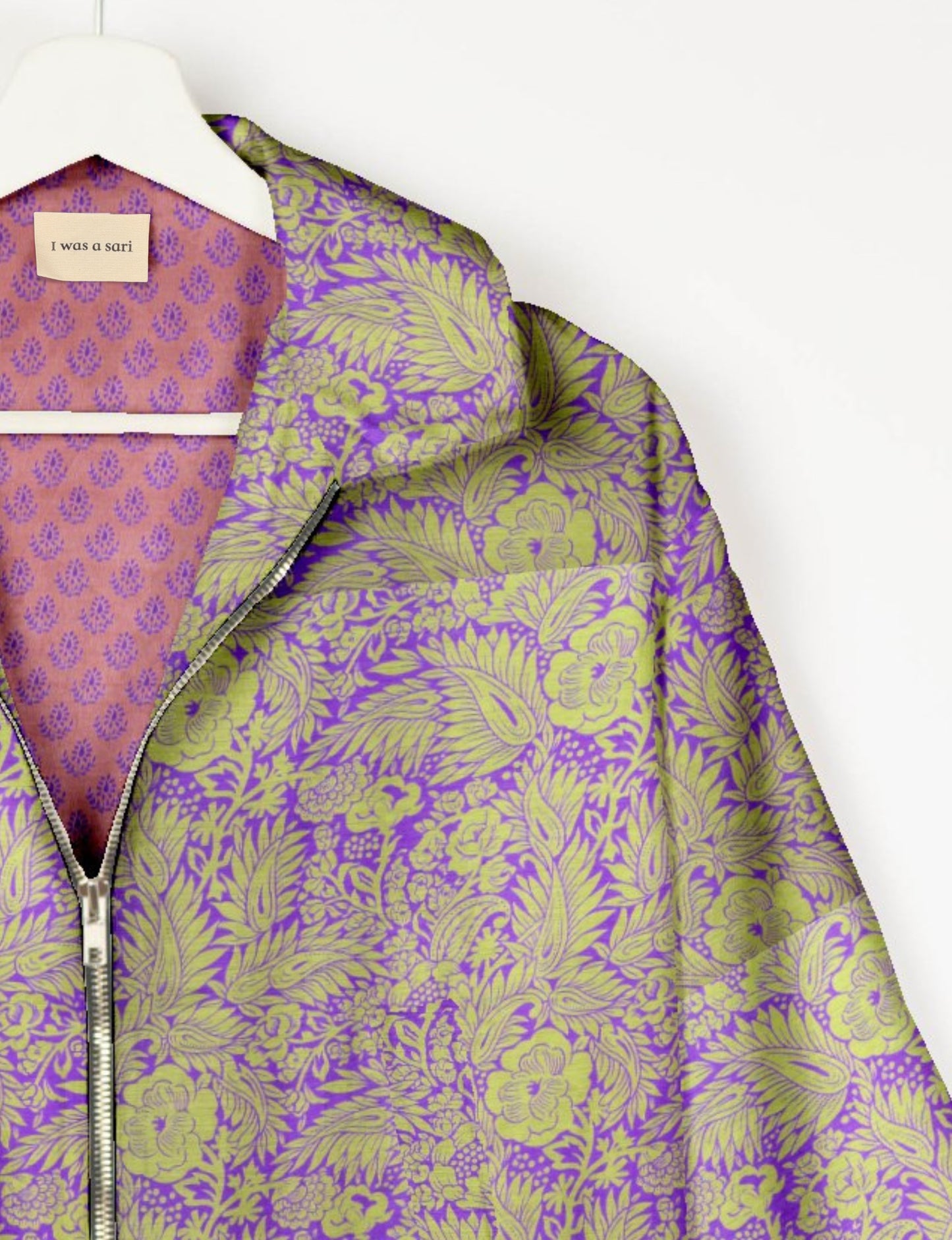 Upcycled Bomber Jacket made from recycled sari materials, featuring a cute cropped shape, elasticated hem and cuffs, and contrast sari print lining. Sustainable apparel promoting eco-friendly fashion and ethical clothing.