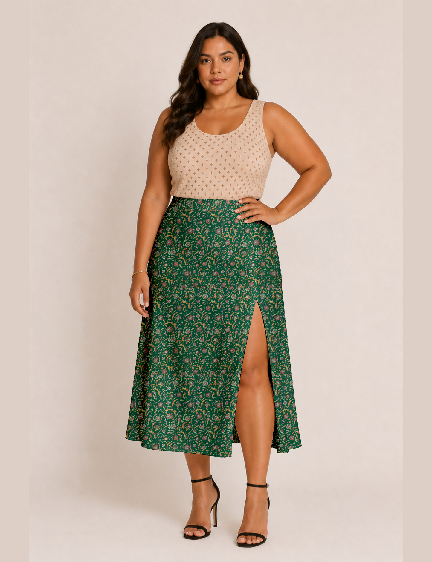 Woman wearing a yellow and black micro patterned A-line skirt with front slit, paired with beige sleeveless top and black