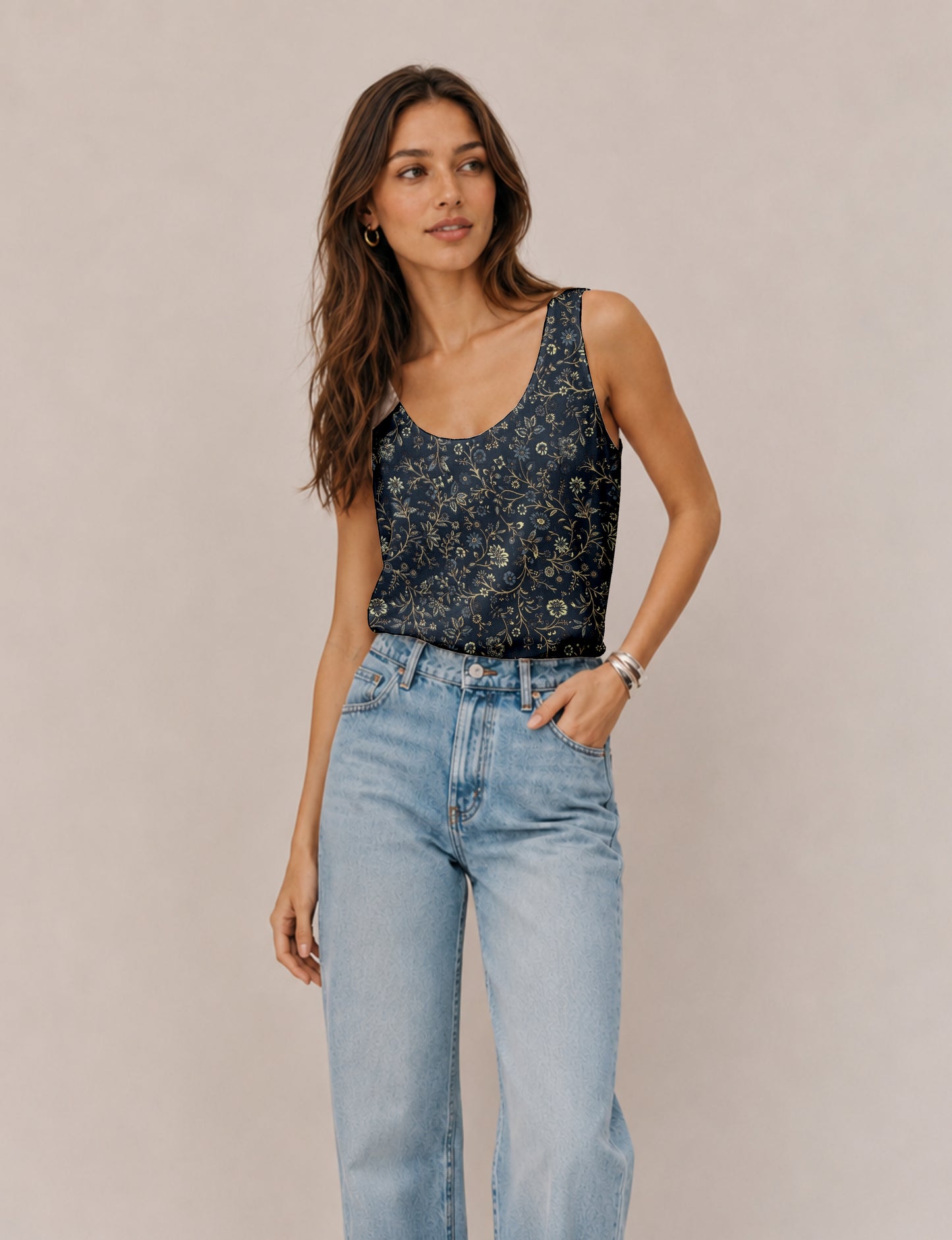 Women's sleeveless blouse with a relaxed straight fit, wide scoop neckline, deep scoop back, and hip-length silhouette.