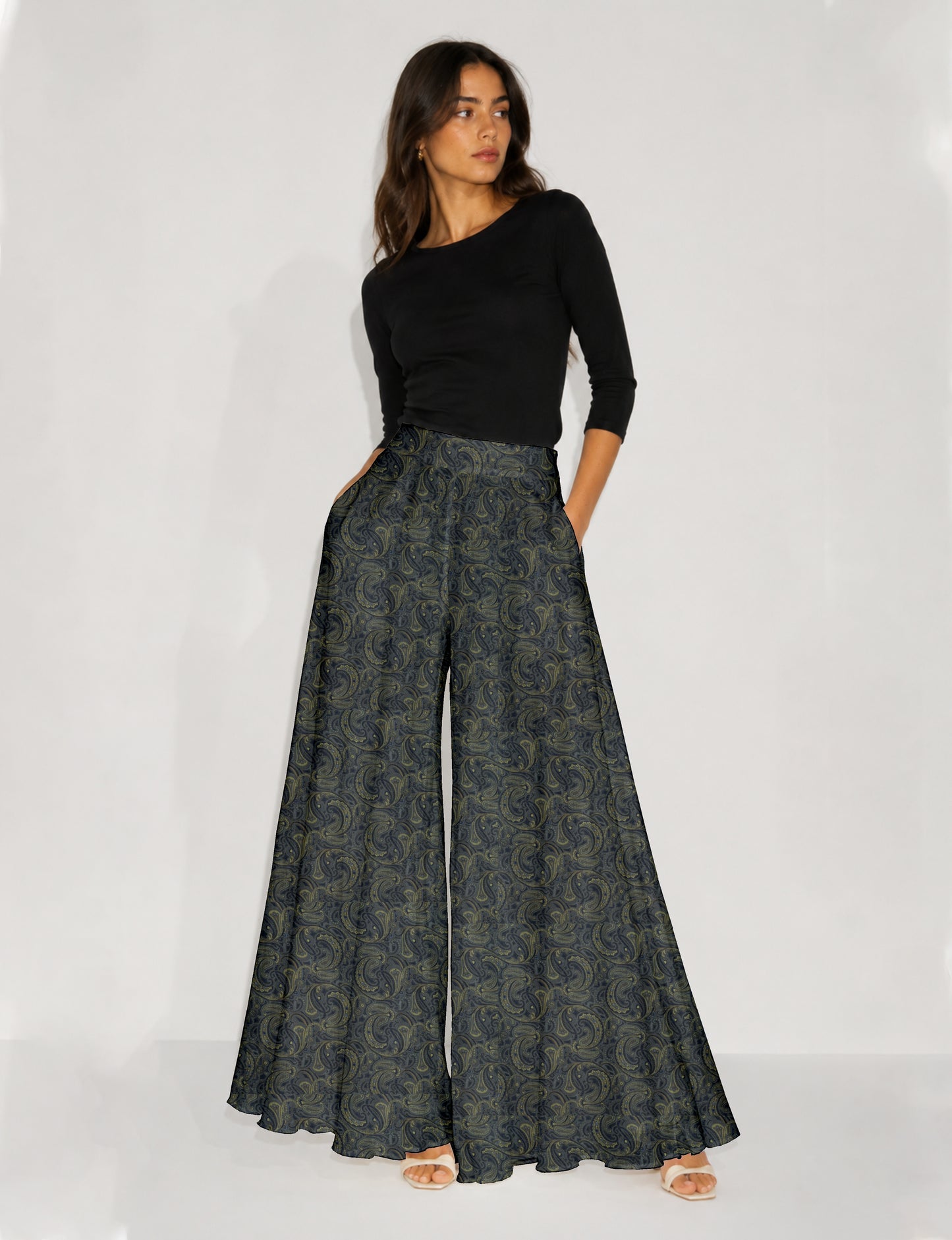 Blue wide leg palazzo trousers with a small tropical floral pattern, flat lay front view