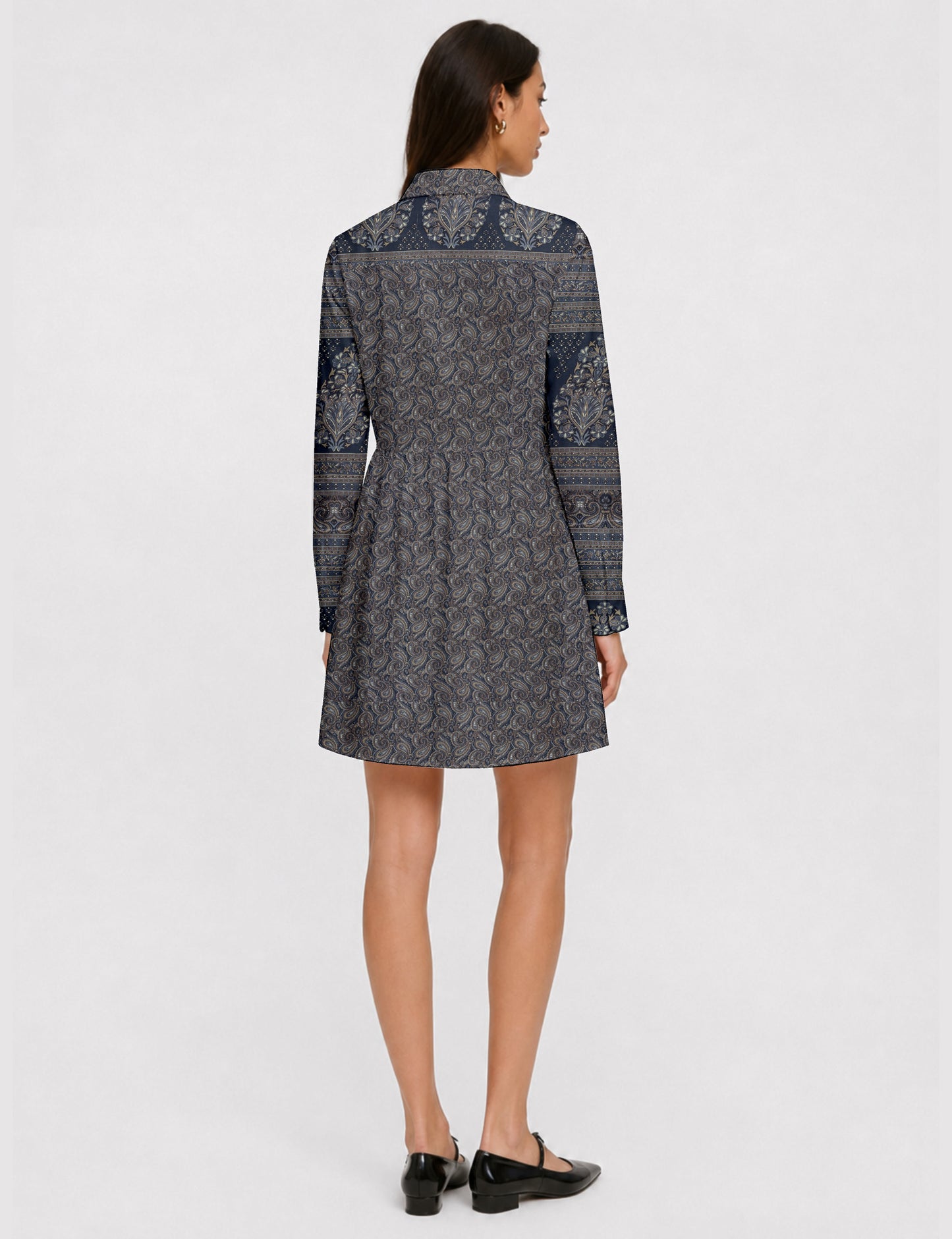 Short shirt dress with a relaxed A-line silhouette, point collar, partial button placket, gathered waist, side pockets, and full-length cuffed sleeves.