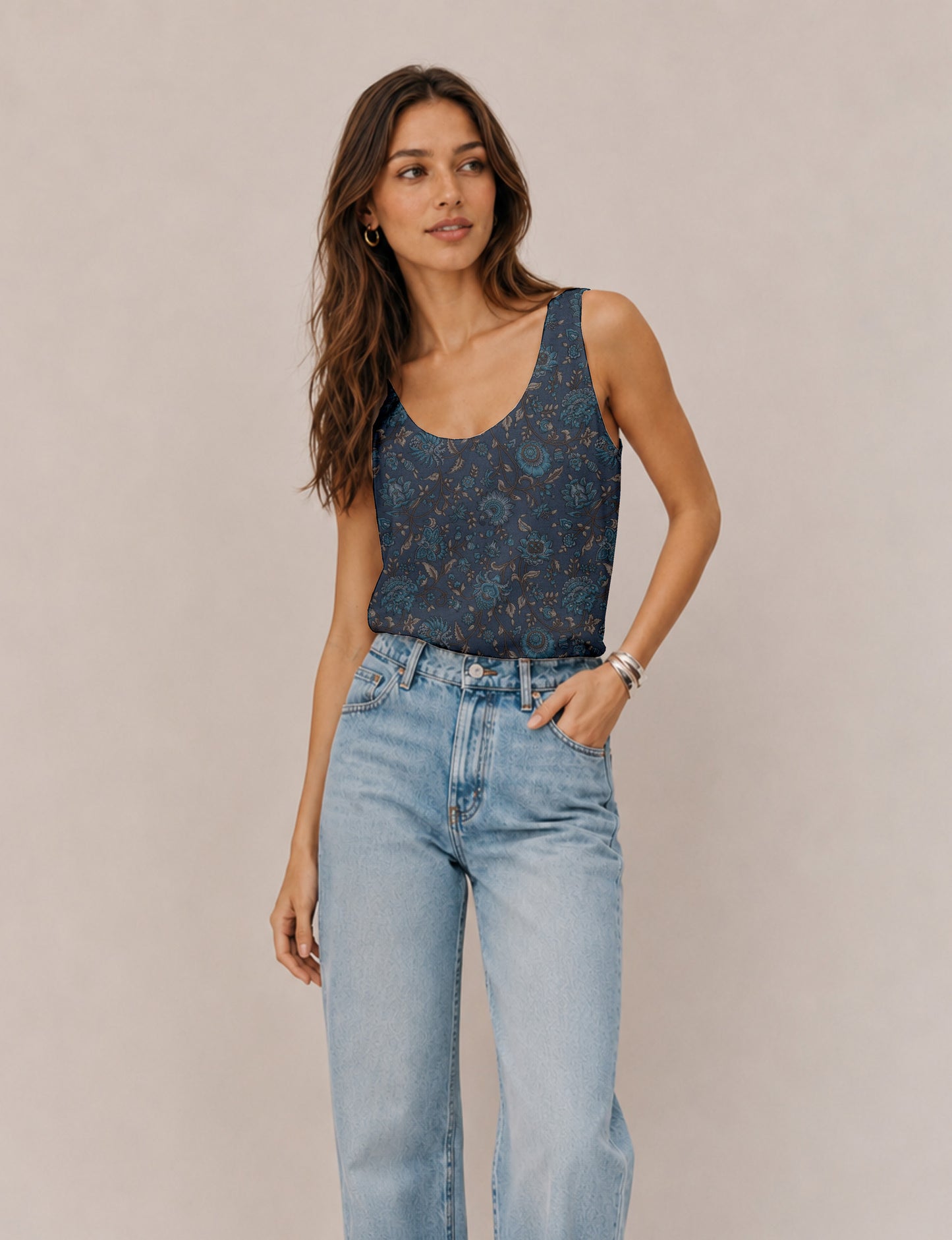 Women's sleeveless blouse with a relaxed straight fit, wide scoop neckline, deep scoop back, and hip-length silhouette.
