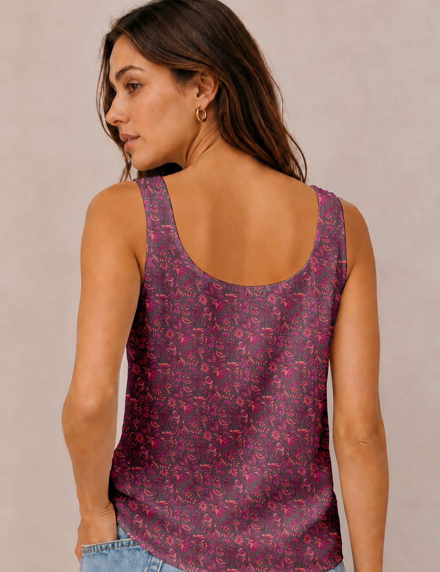 Women's sleeveless blouse with a relaxed straight fit, wide scoop neckline, deep scoop back, and hip-length silhouette.