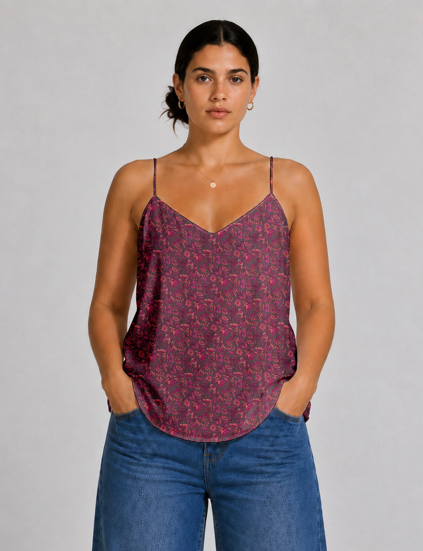 Women's sleeveless slip top with a relaxed straight fit, soft V-neckline, deep V-back, and delicate spaghetti straps.