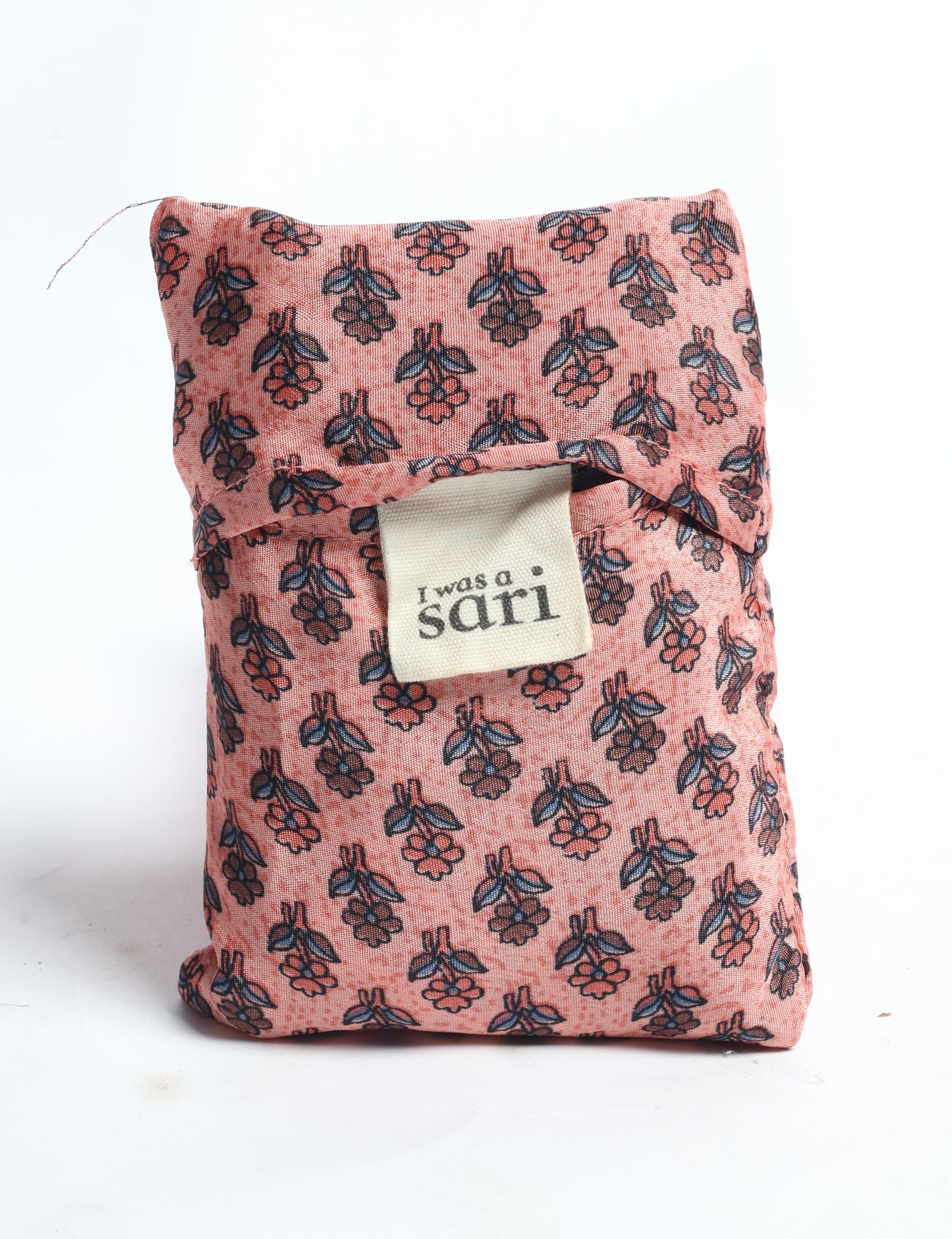 Stay eco-conscious with our Reusable Bag, handmade by Indian artisans from pre-loved saris. Silky and lightweight, this foldaway bag is perfect for your on-the-go lifestyle. Each piece is a unique statement of ethical fashion, embracing sustainability and style.