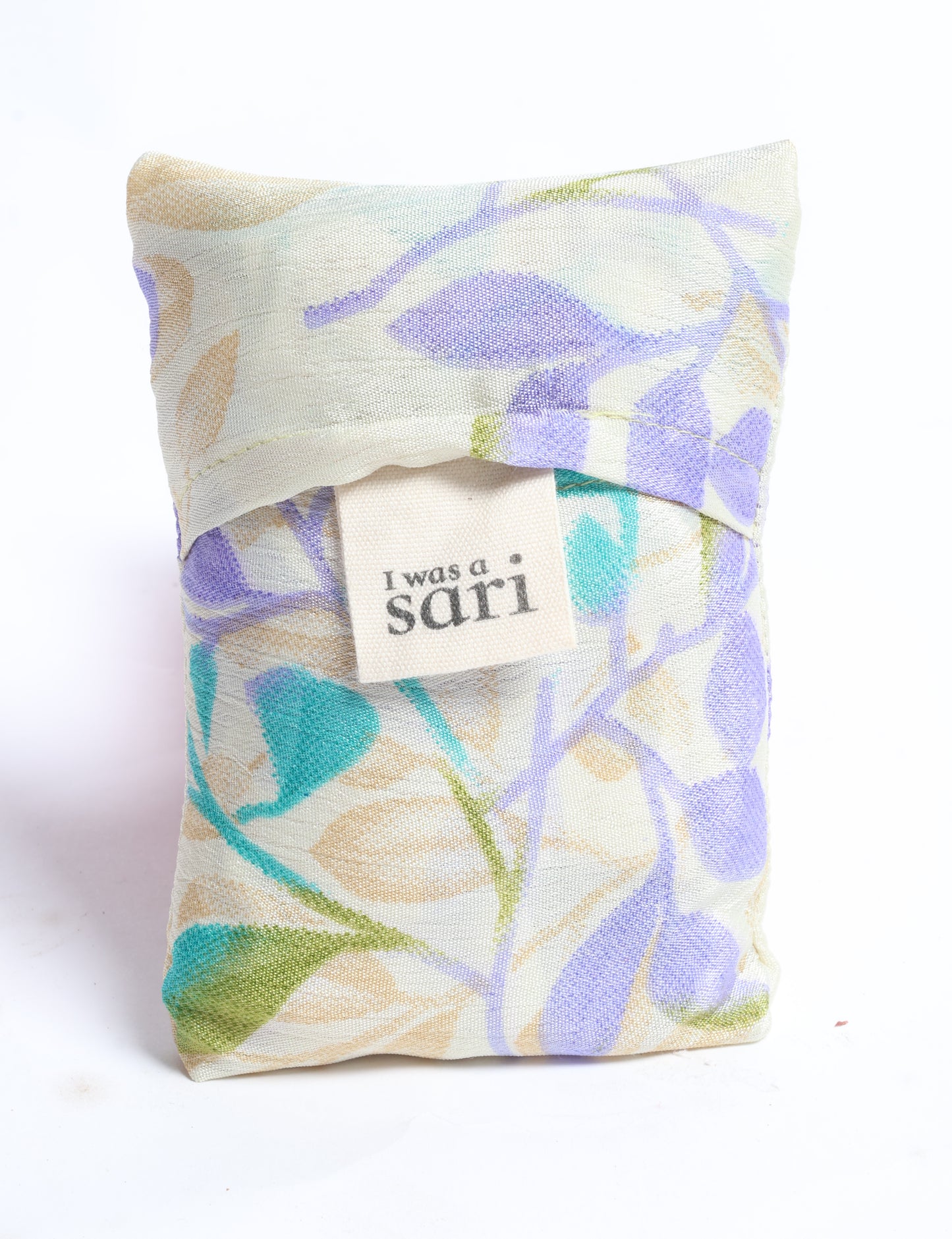 Stay eco-conscious with our Reusable Bag, handmade by Indian artisans from pre-loved saris. Silky and lightweight, this foldaway bag is perfect for your on-the-go lifestyle. Each piece is a unique statement of ethical fashion, embracing sustainability and style.
