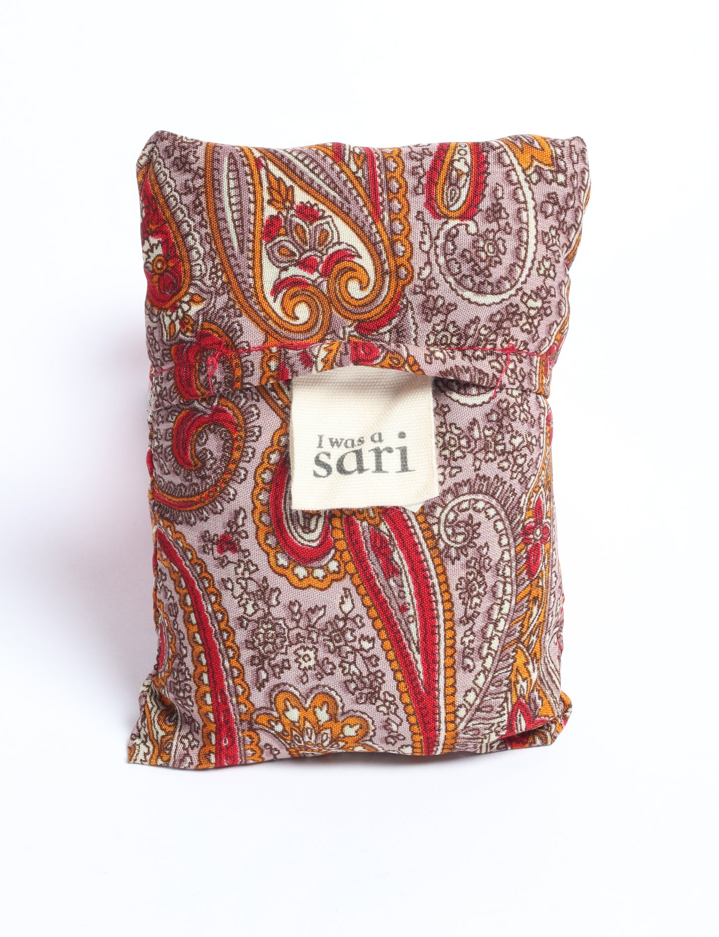 Stay eco-conscious with our Reusable Bag, handmade by Indian artisans from pre-loved saris. Silky and lightweight, this foldaway bag is perfect for your on-the-go lifestyle. Each piece is a unique statement of ethical fashion, embracing sustainability and style.