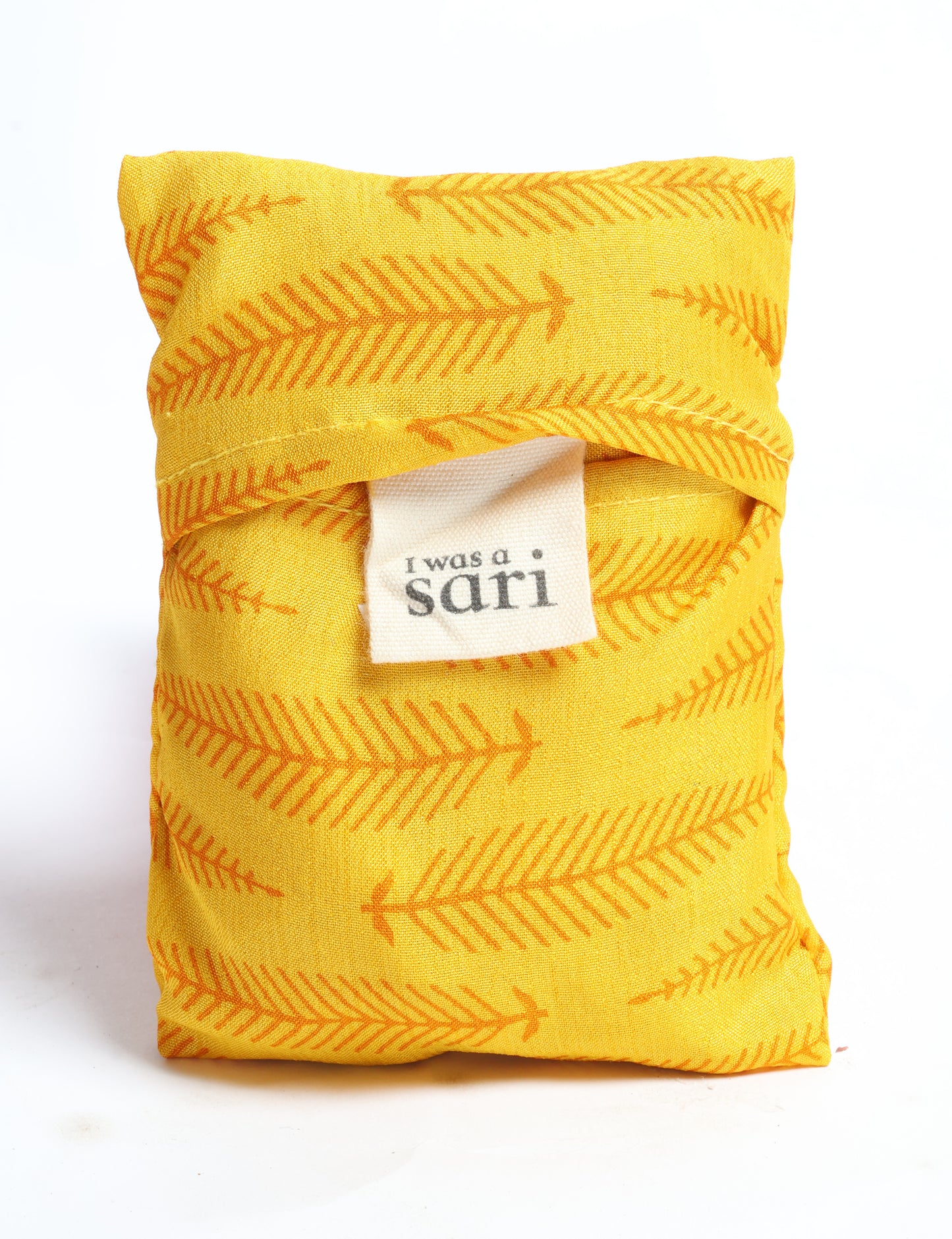 Stay eco-conscious with our Reusable Bag, handmade by Indian artisans from pre-loved saris. Silky and lightweight, this foldaway bag is perfect for your on-the-go lifestyle. Each piece is a unique statement of ethical fashion, embracing sustainability and style.